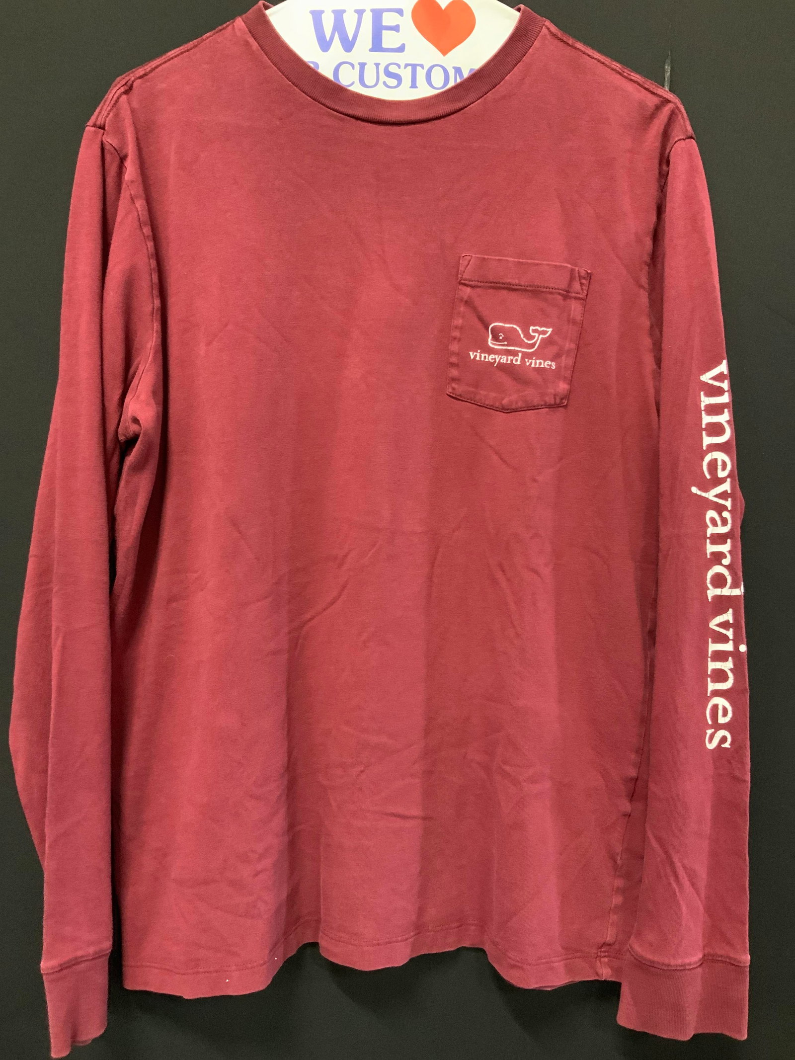 Vineyard Vines Cotton Long Sleeve: Maroon toned cotton long sleeve shirt from Vineyard Vines with white whale logo throughout. Size XL. Sleeves measure 19 inches long and torso measures 25 inches down Moderate wearing to decal prints o