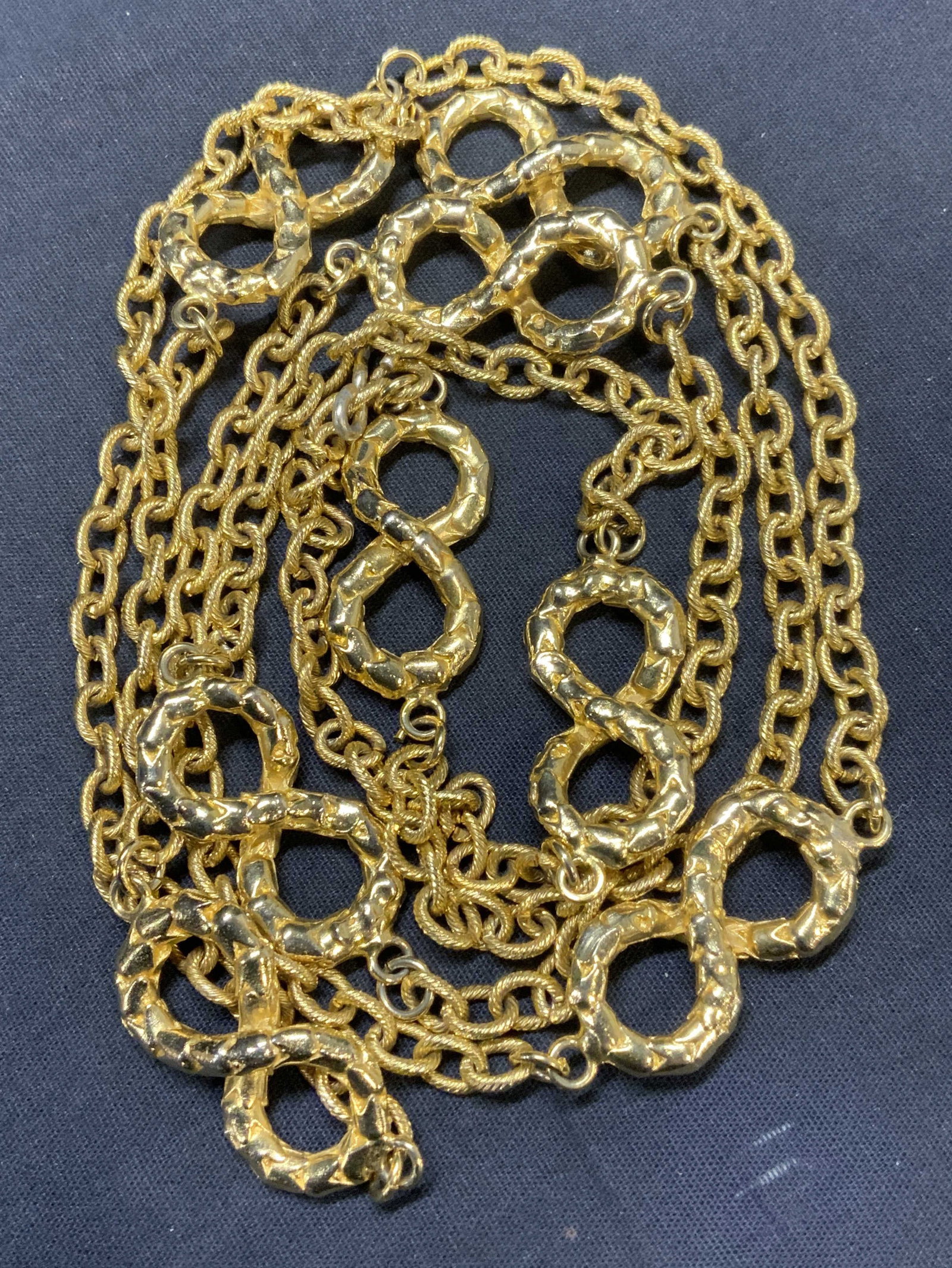 Gold Tone Figure 8 Chain Necklace: Gold tone chain necklace with figure 8 motif. Drop length approx. 28.75 inches. Some scratching observed. Estate jewelry, costume jewelry, cocktail jewelry, fashion jewelry, accessories, fashion acces