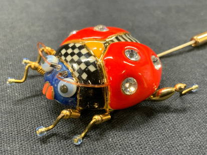 Jewelry 10 Ceramic & Enamel Lady Bug Hat Pin: Marked on underside jewelry 10 hat pin with a ceramic crafted lady bug with enamel front side with crystals embedded in the backing. Approx 3 inches long and 2 inches wide. Minor wearing to