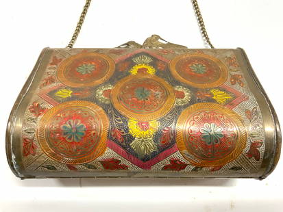 Vntg Etched Brass Floral Enamel Minaudiere Clutch: Minaudiere clutch. Piece is vintage. Clutch appears to be brass with multi toned painted enamel floral medallion, leaf & geometric detail. Top of piece appears to have peacock form clasps. Clutch