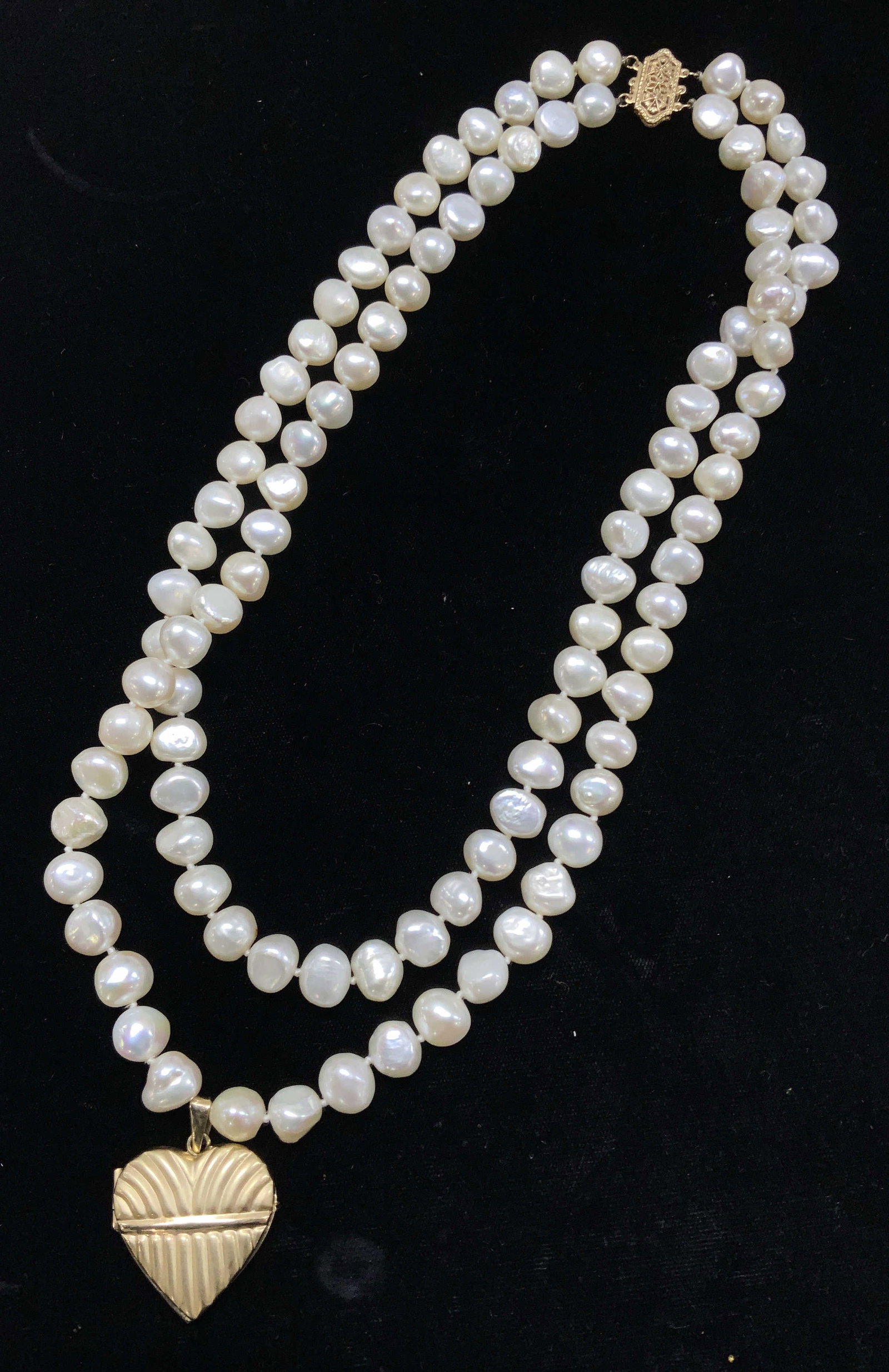 Luxe Baroque Pearl Neck w 14K Gold Heart, Italy: 530 ct baroque pearl double strand necklace , double knotted. Has a large 14k gold heart locket pendant , marked 14k and Italy on bale. Heart measures 1.5 in. Long x 1 1/8 in. Wide. Necklace drop is 7