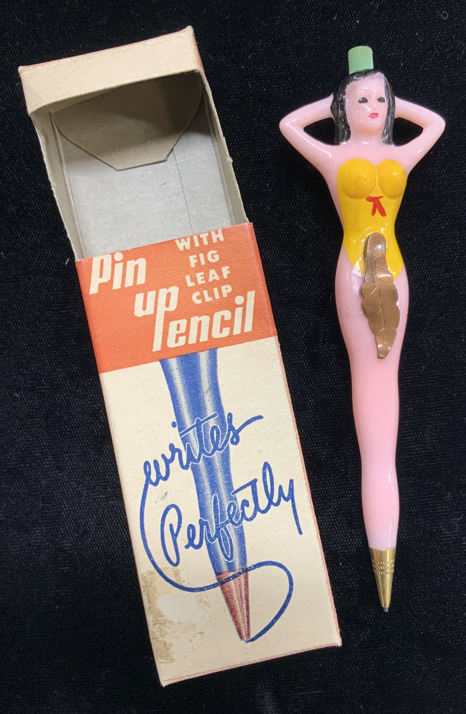 Fishlove & Co. MC Pin Up Mechanical Pencil, NIB: Fishlove & Co. Mid century pin up girl Figural pencil , never used and in the original box. Hand painted on plastic. This is a collectible, c. 1950s. Lady with black hair yellow swimsuit. fig leaf cli