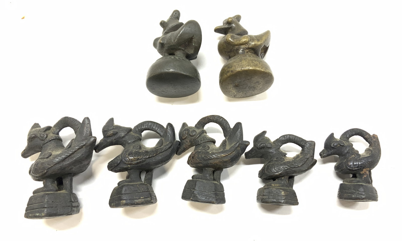 Cast Bronze Animal Figurine Opium Weights, Set 7: Burmese opium weights in cast bronze, animal Figurines. Possibly antique. Some with the ability to hang for weighing. Set of 5 of same animal, decreasing in size. Largest measures 3 x 2.75 in. Ht x W 
