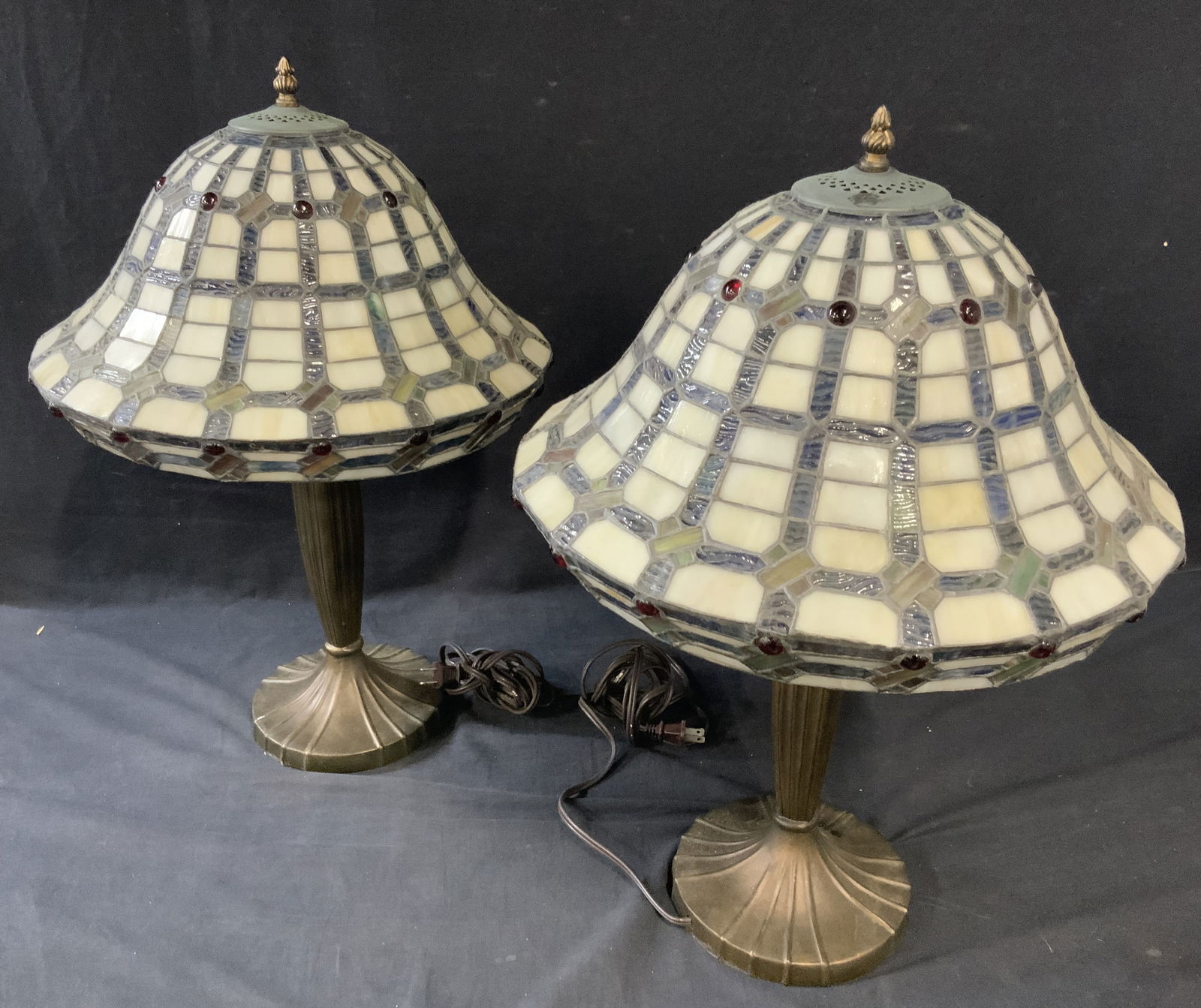 Pair Mosaic Slag Glass Mushroom Shade Lamps: Pair of Mushroom Shade Slag Glass Lamps. Bronzed patina body, pull chain lamps with dual bulbs. Lamp shades have a mosaic motif with red colored glass cabochons. Not tested for functionality. Shade me