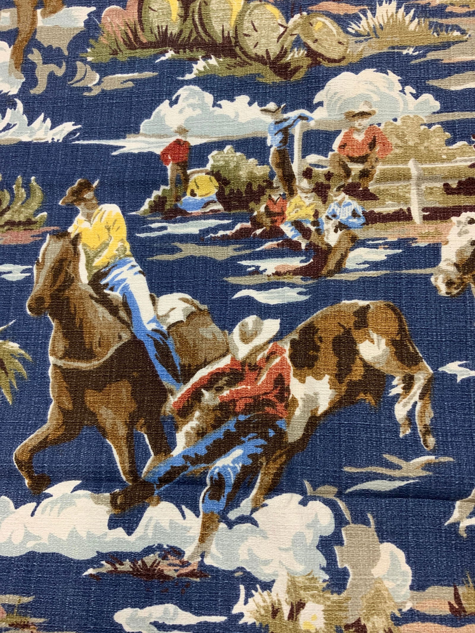 Cowboy Textile/Tablecloth: Cowboy motif tablecloth / textile. Measures 49.5 in. W x 69 in. Long. Up cycle use. Textured fabric. Southwestern cowboy textile, Cowboy motif tablecloth, up cycle fabric, cowboy upholstering, table d