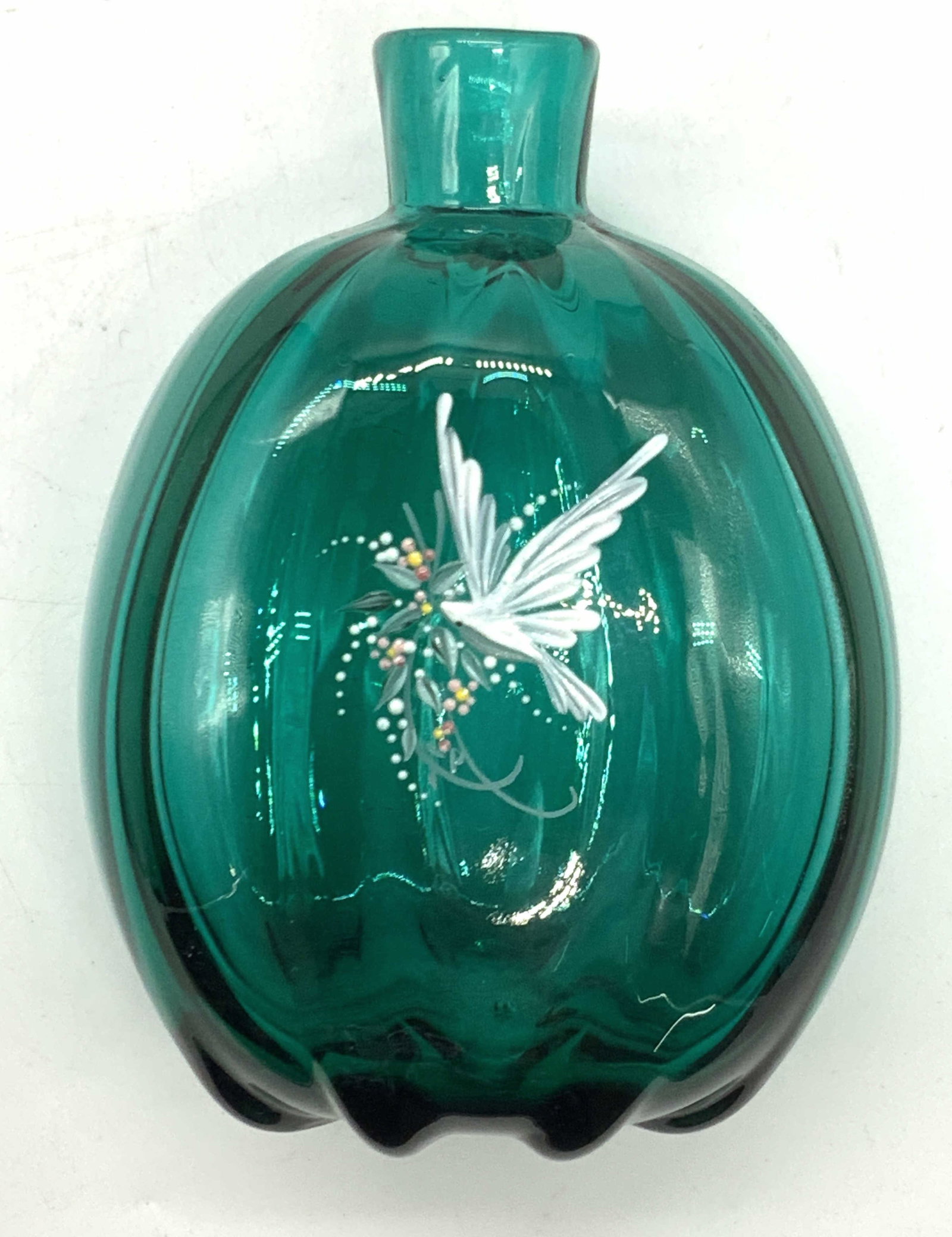 Hand Blown & Painted Art Glass Vessel: Hand blown art glass vase in teal tones with hand painted motif of a white dove on one side, with exterior grooves on sides of bottle Approx 5.5 inches tall and 4 inches wide. Minor wearing to glass a