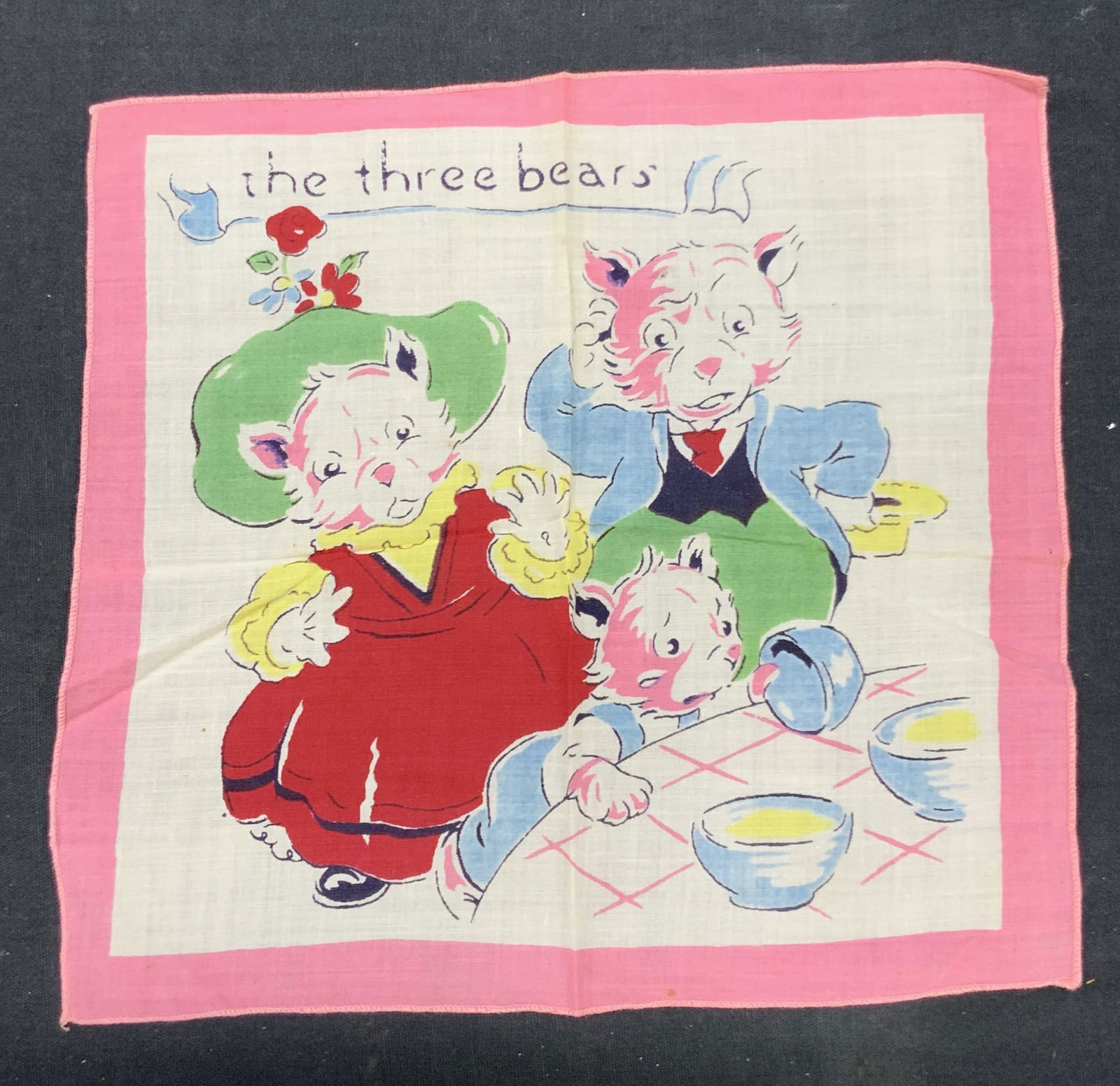 The Three Bears Goldie Locks Linen Handkerchief: Vintage linen handkerchief reading the three bears, depicting the three bears with their porridge from the story Goldie locks and the three bears. Approx 8 x 9 inches. Minor wearing to edges of linen.