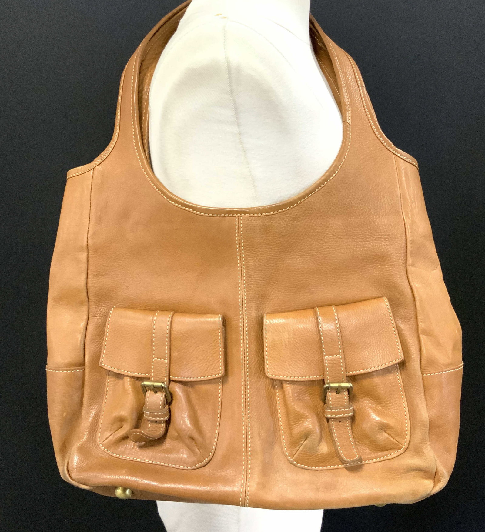 BODEN Leather Handbag Purse Beige: Interior reads BODEN. Handbag is beige toned and leather as reads on inner tag. Exterior has 2 flap pockets with straps. Interior has cellphone pocket and zippered pocket. Interior is cotton and has b