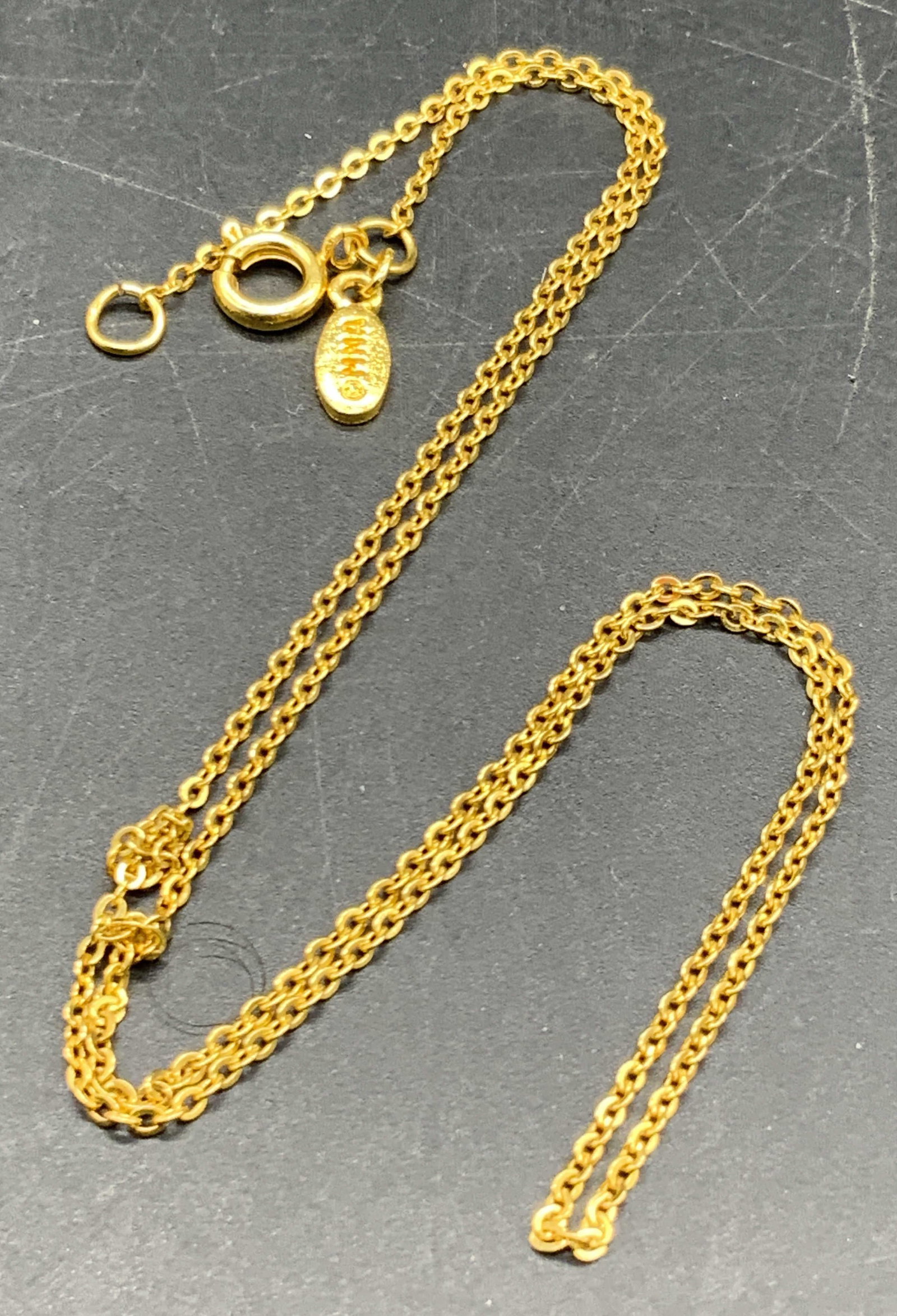MMA Gold Tone Metal Cable Chain Necklace: A gold tone metal cable chain necklace. Length measured end to end approx. 17 inches. Marked MMA on the charm adjacent to the C spring clasp closure. Needs detangling. MMA jewelry, MMA accessories, Fa