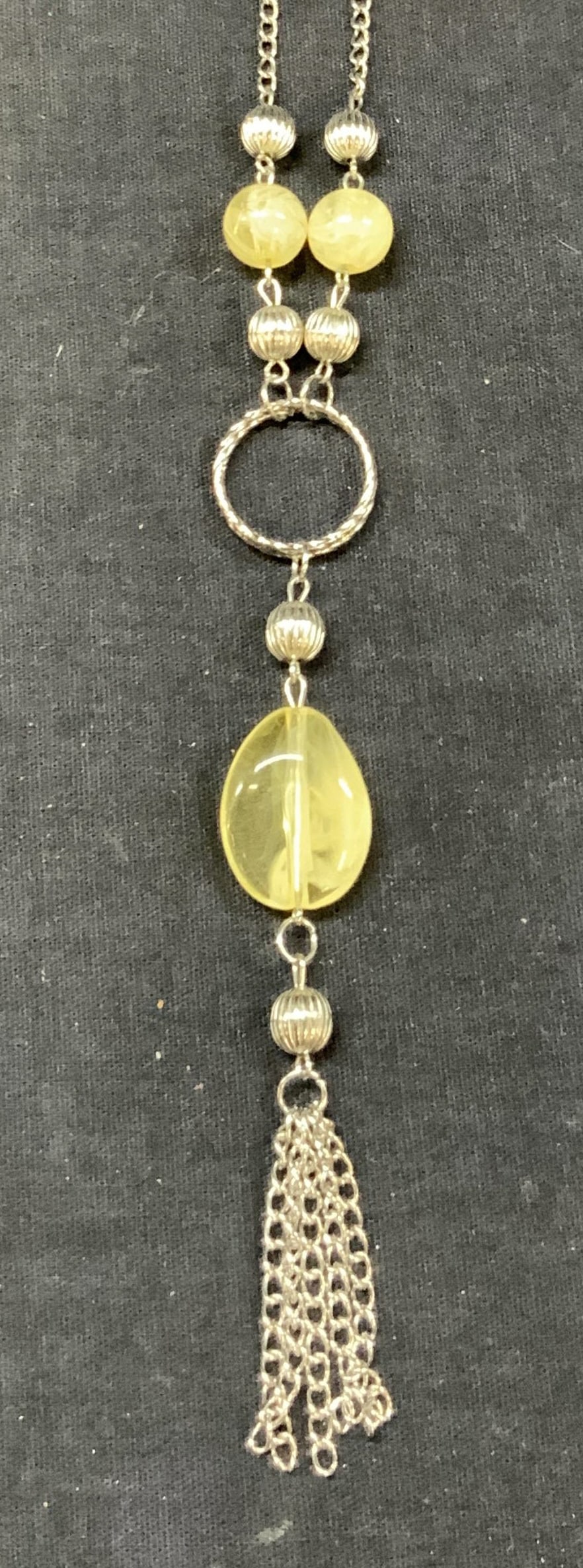 Silver Tn Beaded & Chain Necklace: Silver tone beaded chain necklace with yellow and white toned glass or plastic beaded with hanging chains and silver toned beads. Approx 10 inches long. Minor wearing to claps and wearing from age and