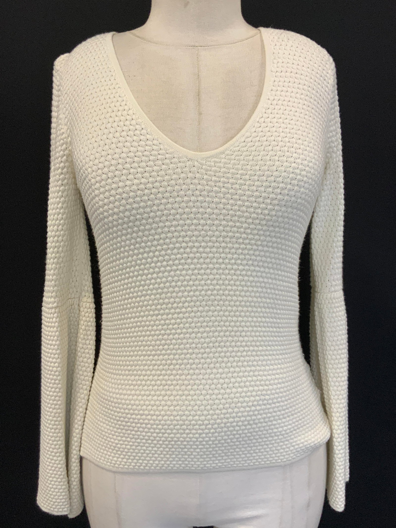 Patricia Pepe Material Blend Long Sleeve Shirt: Cream toned long sleeve v neck with flared sleeves. marked Patricia Pepe, size 1. With sleeves measuring 17 inches long, torso measuring 22 inches long and chest measuring 15 inches across. Textured w