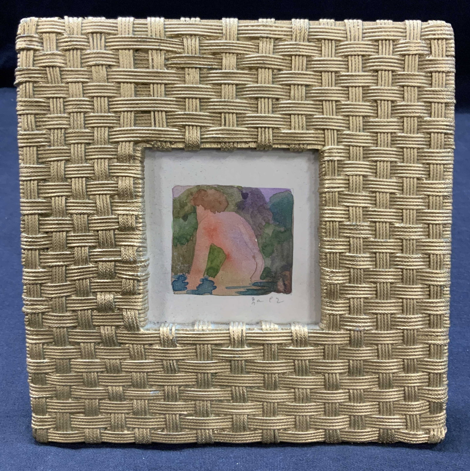 Sgd Nude Watercolor Painting, Framed: Signed on lower corner, depicting a nude man in a lake. Framed in a gold toned woven metal easel frame. Approx 7 x 7 inches window measures 3 x 3 inches. Moderate wearing to frame and corners and mino