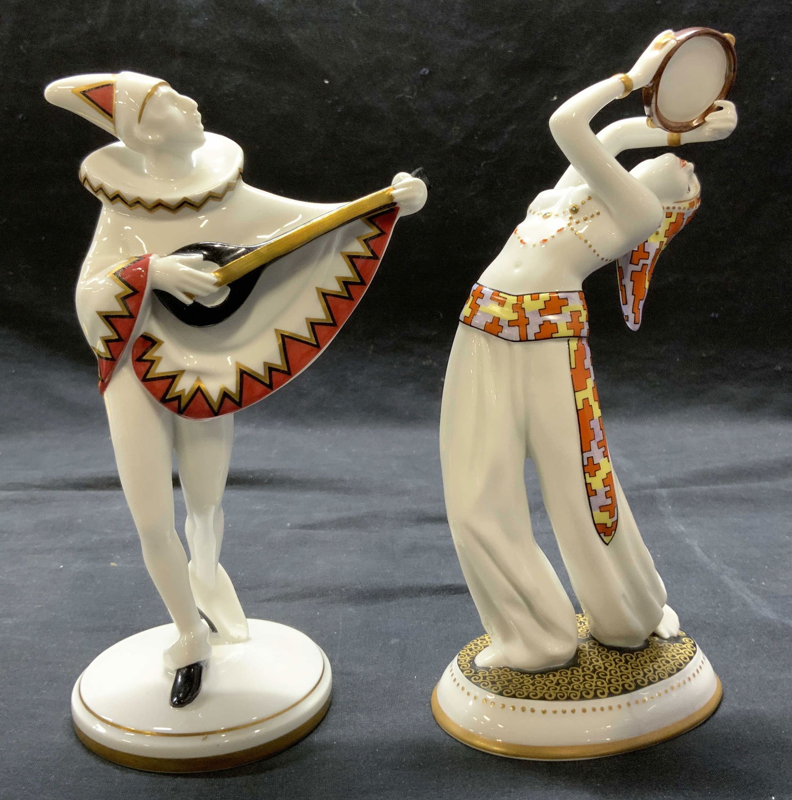 Pr GOEBEL MINSTREL & TAMBOURINE Porcelain Figures: Undersides of each figure are marked GOEBEL W GERMANY. One reads TAMBOURINE No. 0314 (depicts a partial female nude figure, the other reads MINSTREL no. 0085. Each piece is porcelain. Possibly hand pa