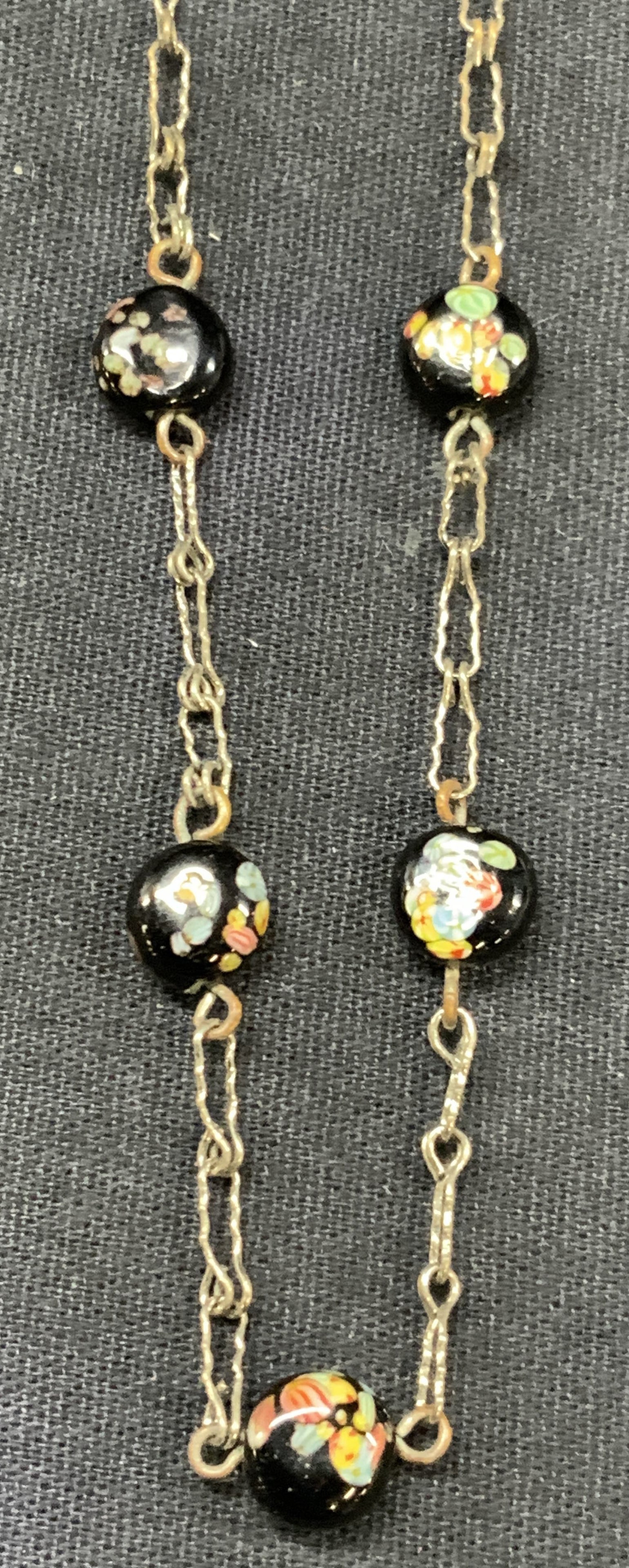 Vntg Art Glass Beaded Choker Necklace: Vintage choker Necklace made with silver toned chain and art glass beads of black with colored flowers. Approx 6.25 inches long. Moderate wearing to chain due to age and use. Vintage choker necklace, 