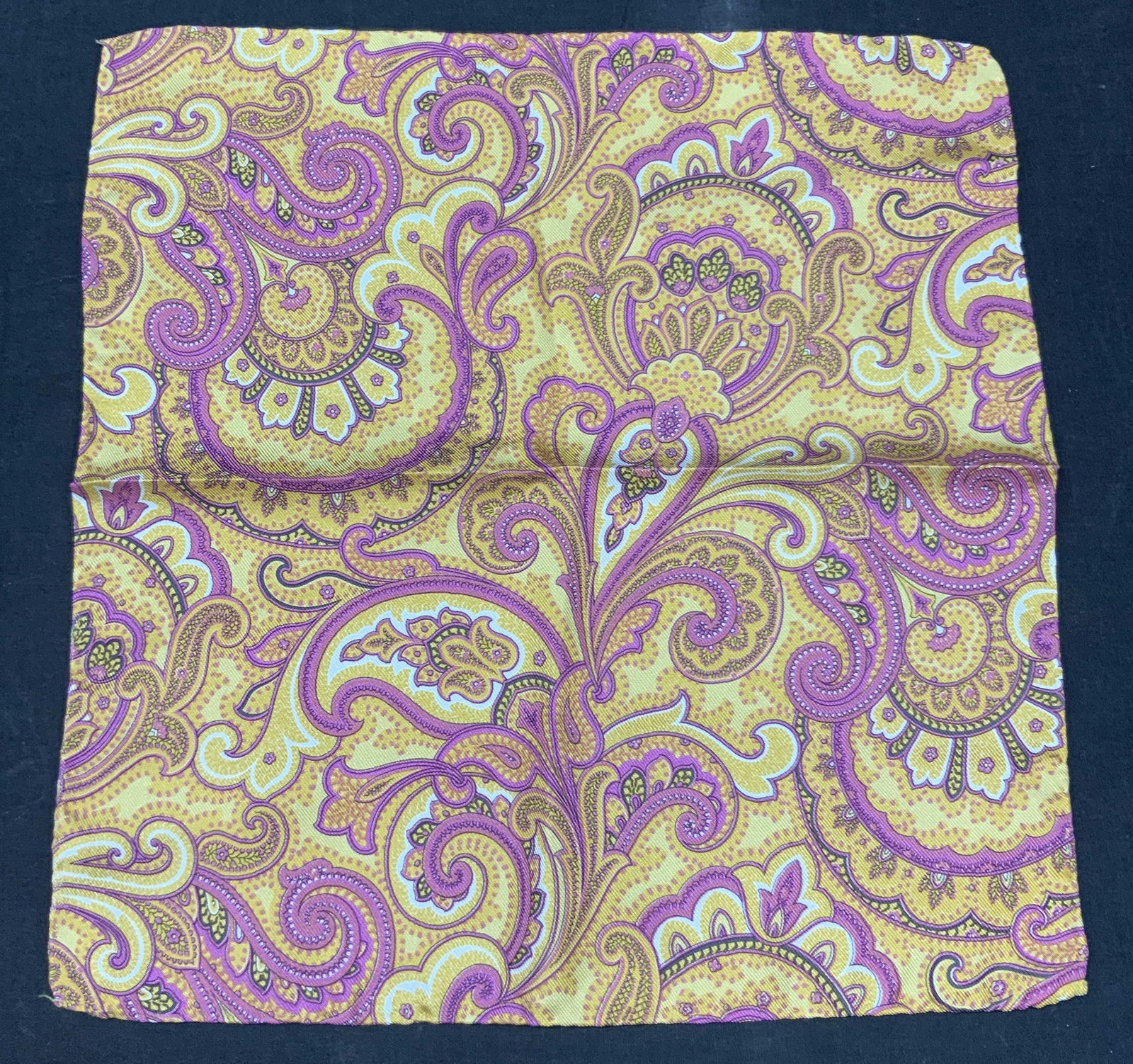 Alten Silk Paisley Handkerchief, Italy: Marked on tag Alten, Milan, 100% silk, with hand rolled edges in a pink and orange paisley design. Approx 12 x 12.75 inches Minor wearing to handkerchief due to age and use. Silk handkerchief, pocket