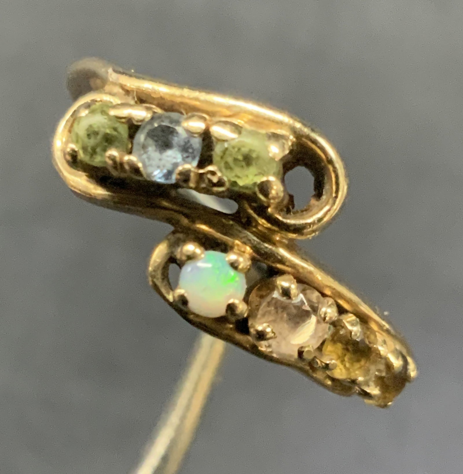 10k Gold Ring W Encrusted Stones: Marked on band 10k ring with prong setting faceted Quartz stones. Ring size 4.5. Minor wearing to band, scratches observed. Total weight 2.3 grams Rings. Stone rings, gold rings. Jewelry, gold jewelry