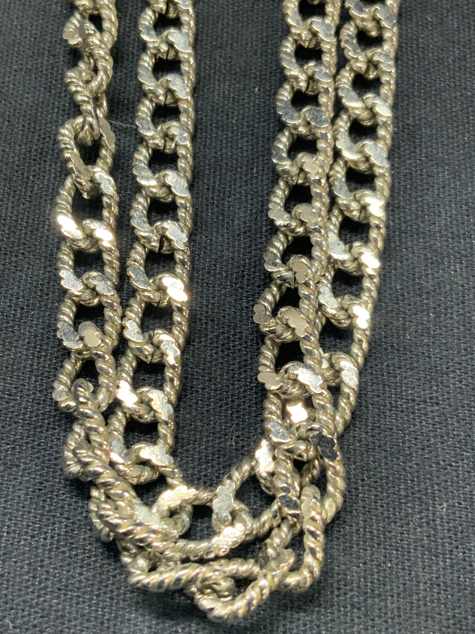 Monet Silver Tn Lariat Chain Necklace: Marked Monet on claps. Silver toned and etched Chain lariat necklace, at 26 inches long. Minor wearing to chains due to age and use. Vintage lariat Necklace. Necklace. Ladies jewelry, costume jewelry,