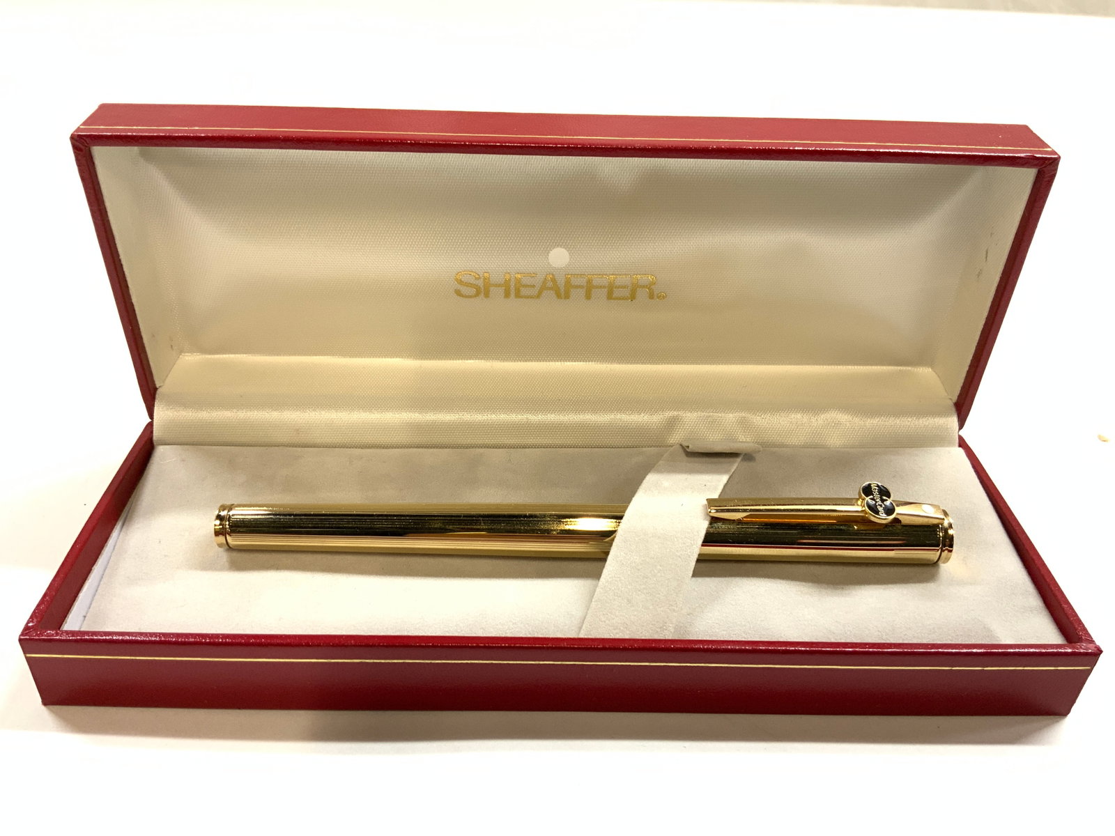SHEAFFER Gold Electric Plated Pen & Case: Pen is inscribed SHEAFFER GOLD ELECTRIC PLATED. Case is red toned with gilt lettering which reads SHEAFFER. Pen includes cap. Pen also has MASTER CARD logo. Pen measures approximately 5.5 inches long,