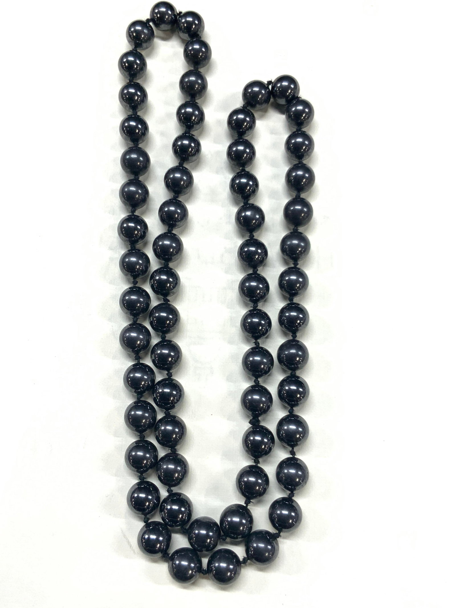 Polished Hematite Beaded Necklace: Necklace of polished hematite beads with single knots between each bead, approx 13.25 inches long. Beads being 6mm wide. Minor wearing to beads due to age and use Hematite beads, beaded jewelry, vinta
