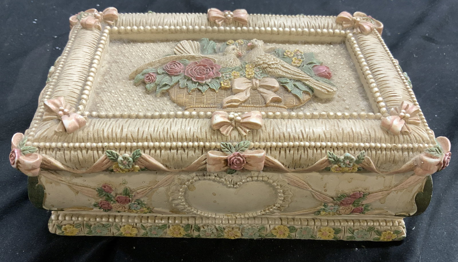 Cast Resin Jewelry Box W Doves & Floral Motifs: Jewelry Box is cast resin. Piece is cream with multi toned floral, leaf, dove & beadwork detail. Jewelry box has hinged lid. Piece measures approximately 8 inches wide 5 inches deep 3 inches tall. Jew