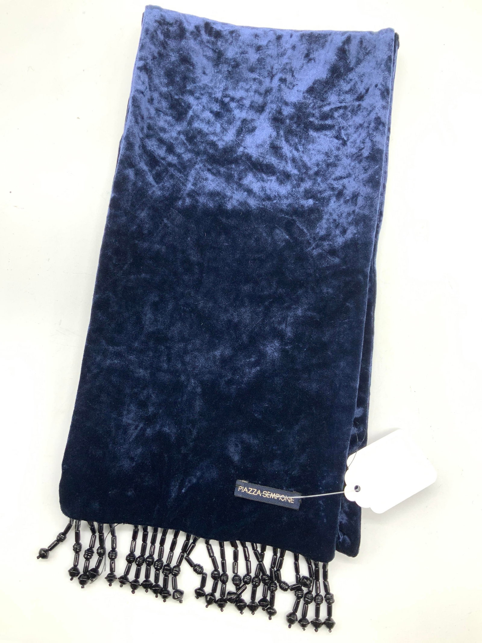 Piazza SEMPIONE Velvet Beaded Scarf: Navy blue toned velvet Material scarf with beaded fringe on ends. Marked on tag Piazza SEMPIONE, Approx 50 inches x 7 inches wide. Minor wearing to threading and loss to beading on ends. Beaded scarf,