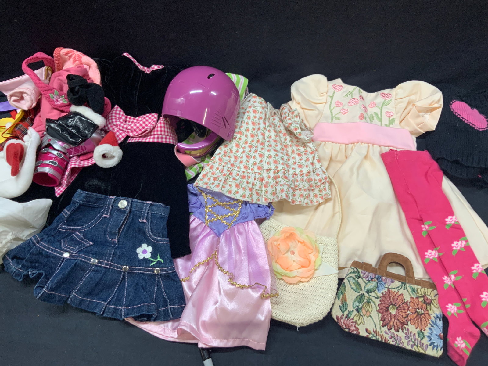 Lot 10+ My Twin Doll Clothes: Lot of 10+ clothing for My twin dolls. Dresses, denim shirts, Helmets, velvet dresses, princess dresses and socks. Largest piece is 15 x 16 inches Comes in brown Coach box,14 x14 x 5 inches Minor wear