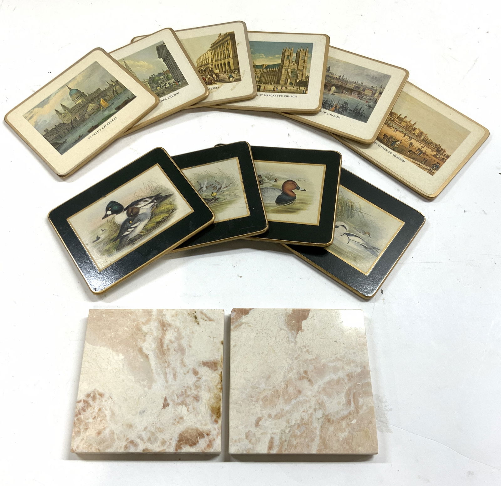 Lot 12 Cork & Stone Coasters Matador & More: Lot includes 10 cork coasters & 2 stone coasters. Six coasters tagged MATADOR (each with historical architecture detail), 4 tagged LADY CLARE (each with duck detail). Stone coasters are each pink & wh