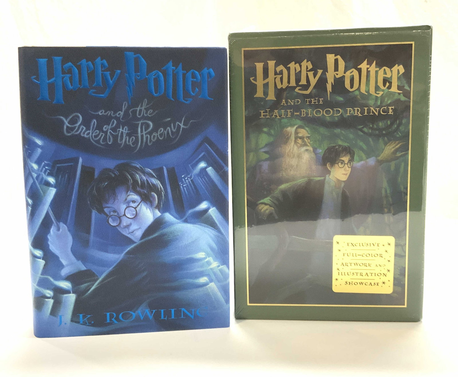 2 Harry Potter Books 5+6, NIP JK Rowling: Harry Potter & the Order of The Phoenix and Harry Potter and the Half- Blood Prince ( this book is new in package in a protective sleeve box with an exclusive full color artwork and illustration showc