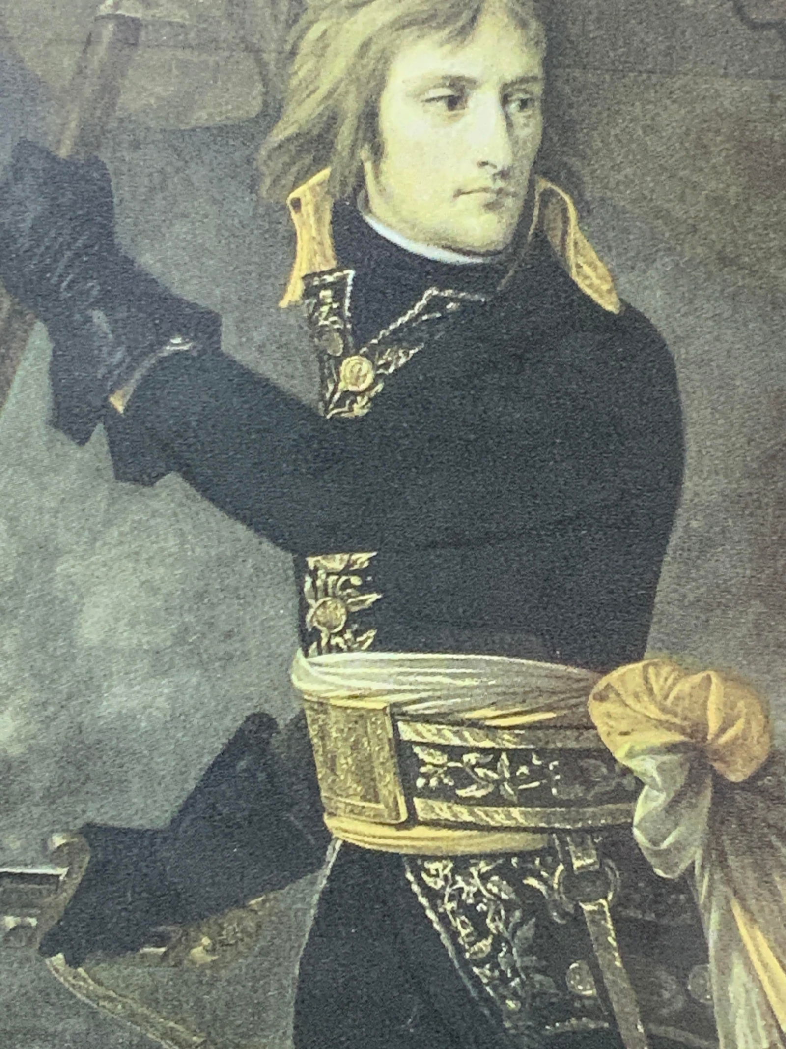 Bonaparte At Battle Of Arcola Vntg Lithograph: Lithograph of Bonaparte at battle of Arcola, originally done by Antoine Gros. Depicts Bonaparte with a sword and flag in hands. Framed in a black wooden frame with off white mat board. Approx 10 x 8 i