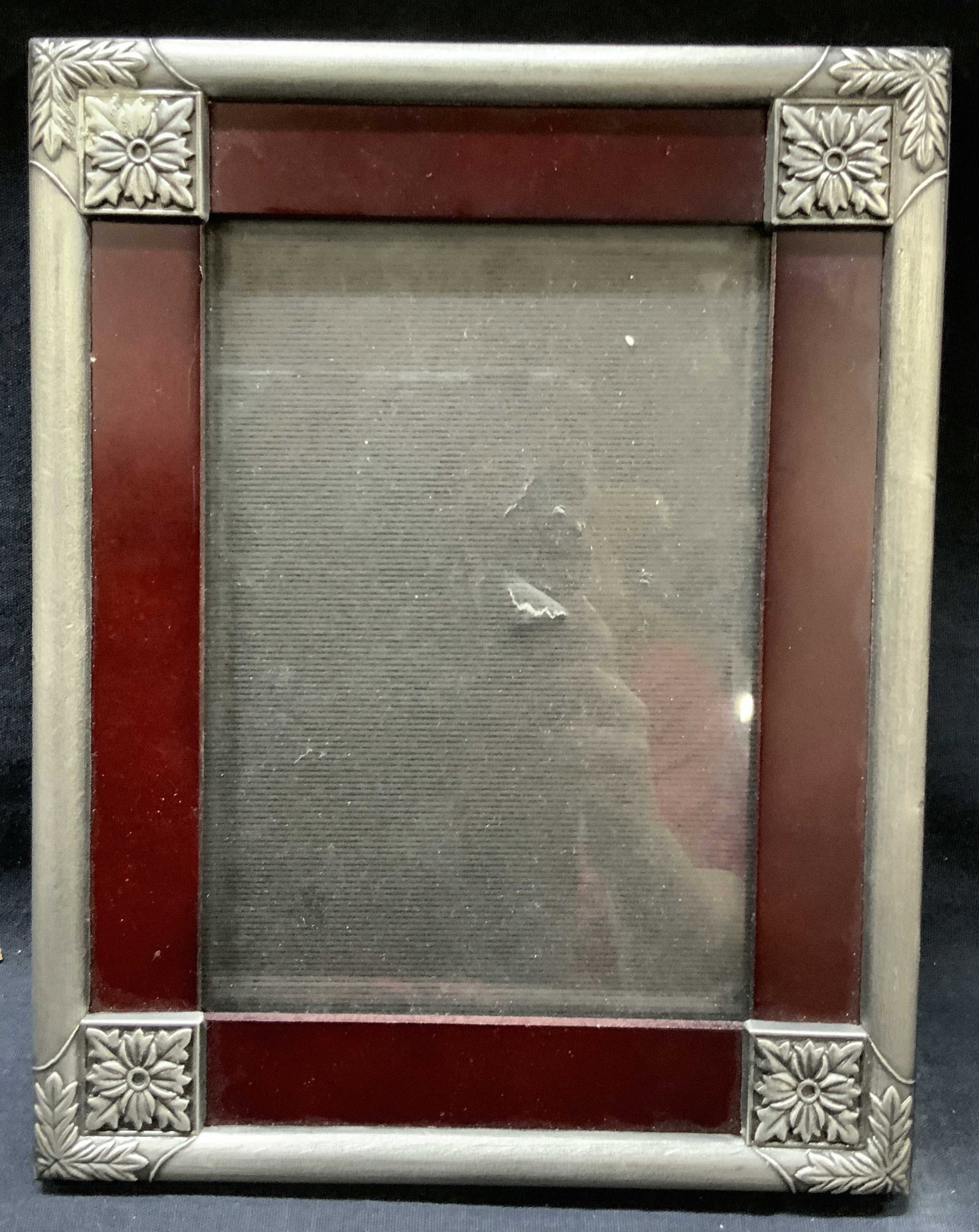Red Wood & Floral Picture Easel Frame, Korea: Red toned wooden easel picture frame with floral edges in gray and black velvet backing, marked Made In Korea. Approx 9 x 7 inches window measures 6.5 x 4.5 inches Moderate wearing to wooden frame and