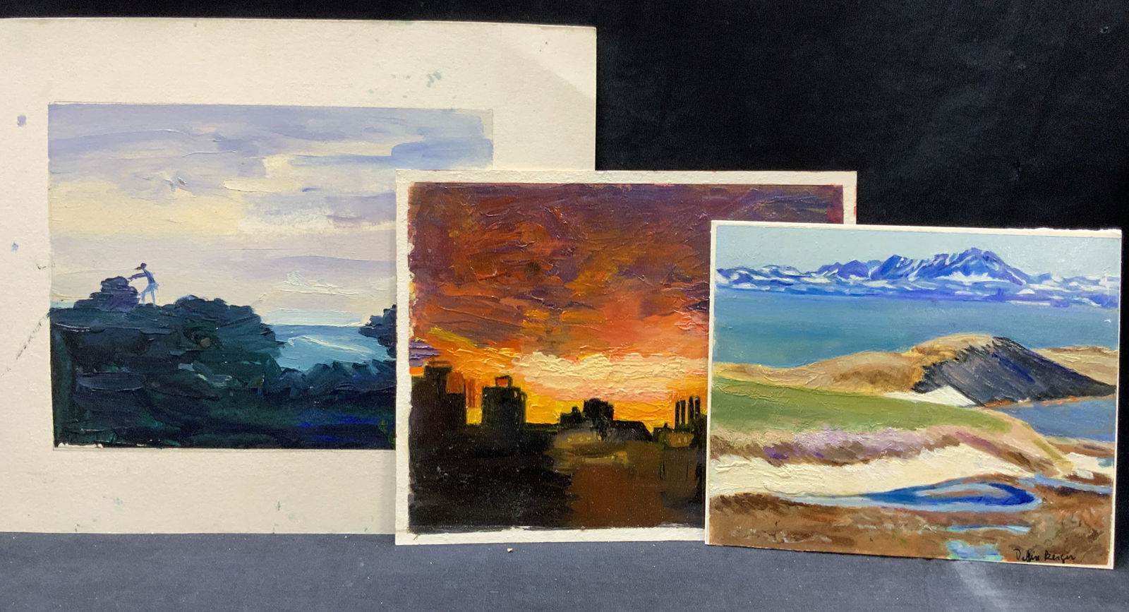 3 Debbie Berger Sgd Landscape Gouache Paintings: Lot of 3 gouache and acrylic landscape paintings on papers. 1 signed Debbie Berger, depicting a vast mountain scape with blue rivers and clay hills. 1 depicting the City during a sunset and another de