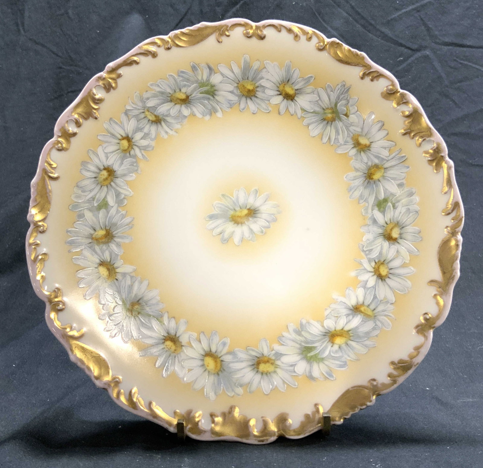 T&V FRANCE Porcelain Floral & Gilt Plate: Underside reads T&V FRANCE. Plate is porcelain with floral and gilt scroll detail around rim. Plate appears to be vintage. Piece may have some hand painted elements. Plate measures approximately 8.25 