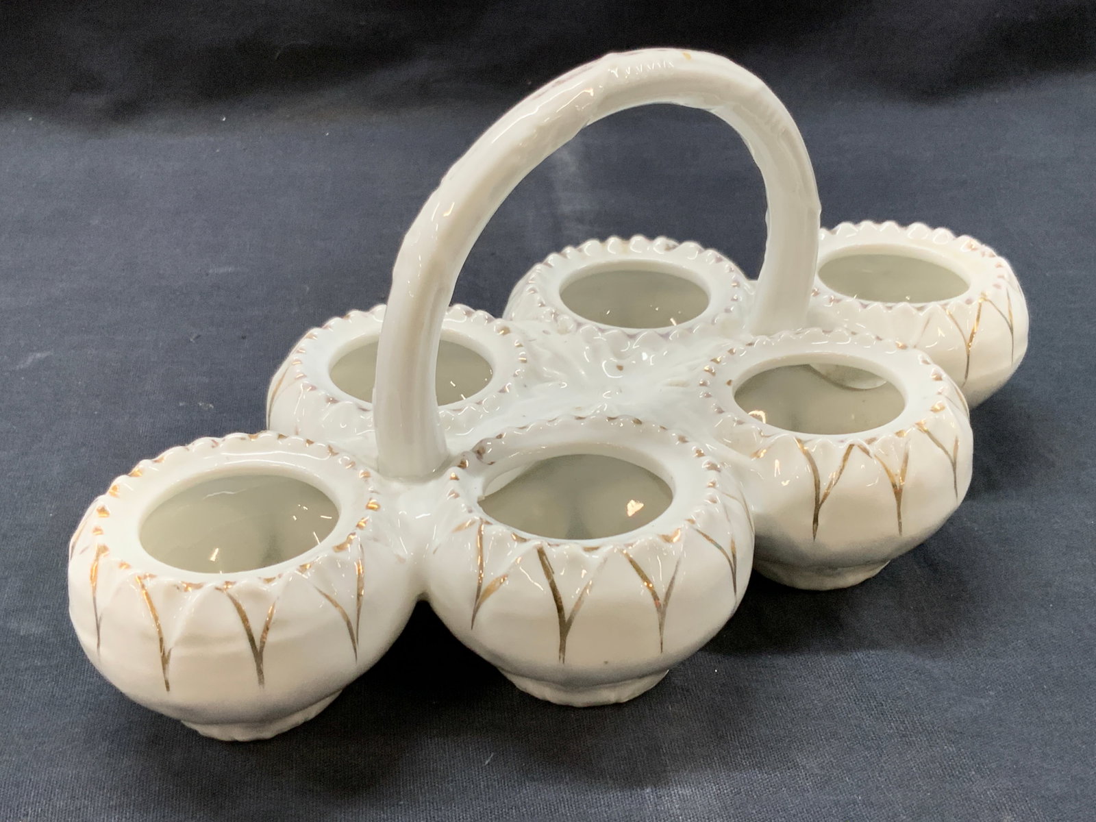 Vntg Gilt Porcelain Egg Cruet: Vintage white porcelain egg cruet with gilt edges and top handle. Approx 5 inches tall and 9 inches long and 5 inches wide. Moderate wearing to gilt and to porcelain Porcelain kitchen decor, kitchen a
