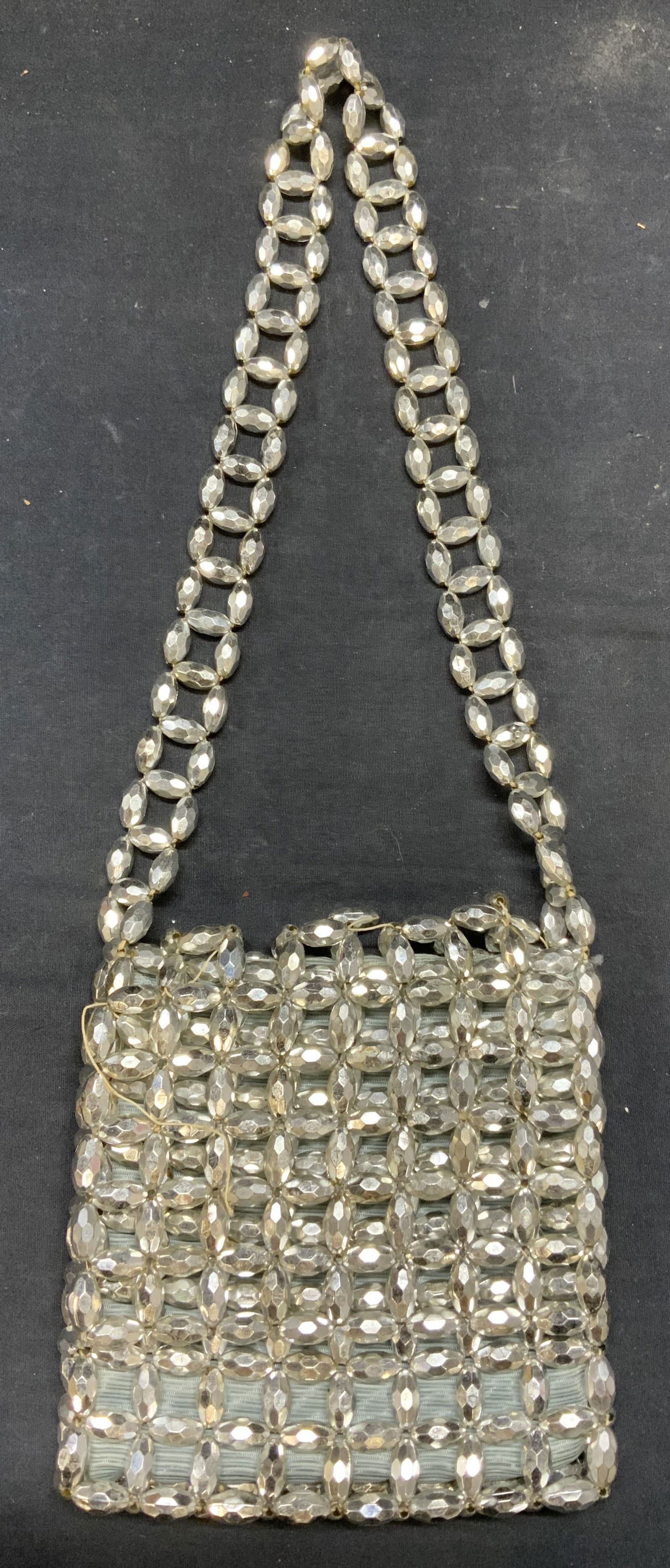 Vintage Silver Tn Beaded Handbag, Italy: Vintage silver tone beaded handbag. Made in Italy. Some beads loose or need replacement. Measures approx. 7 x 1 x 6.5 inches. Some scratching observed. Property of Manhattan estates and fashion indust