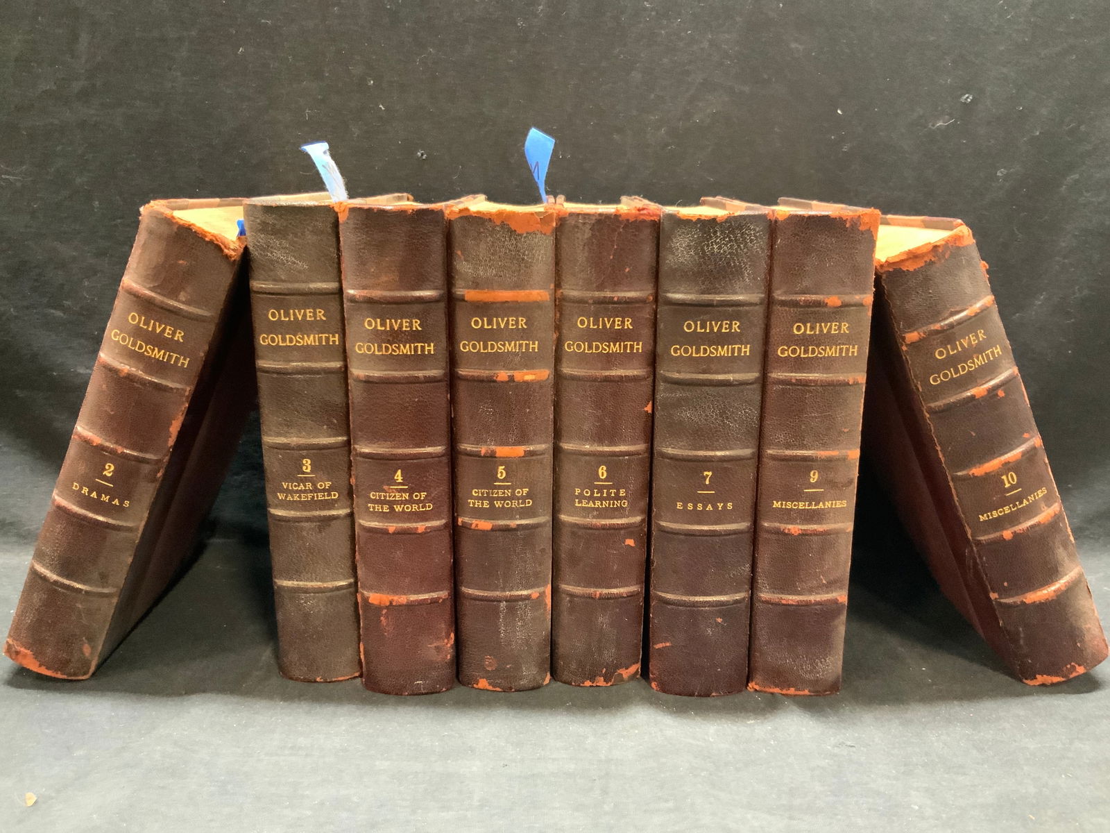 Group Lot Antique OLIVER GOLDSMITH Books: Collection of antique books by Oliver Goldsmith. The books are bound in what appears to be leather and fabric. There is a degree of wear on the bindings. Some volumes are missing. The pieces measure a