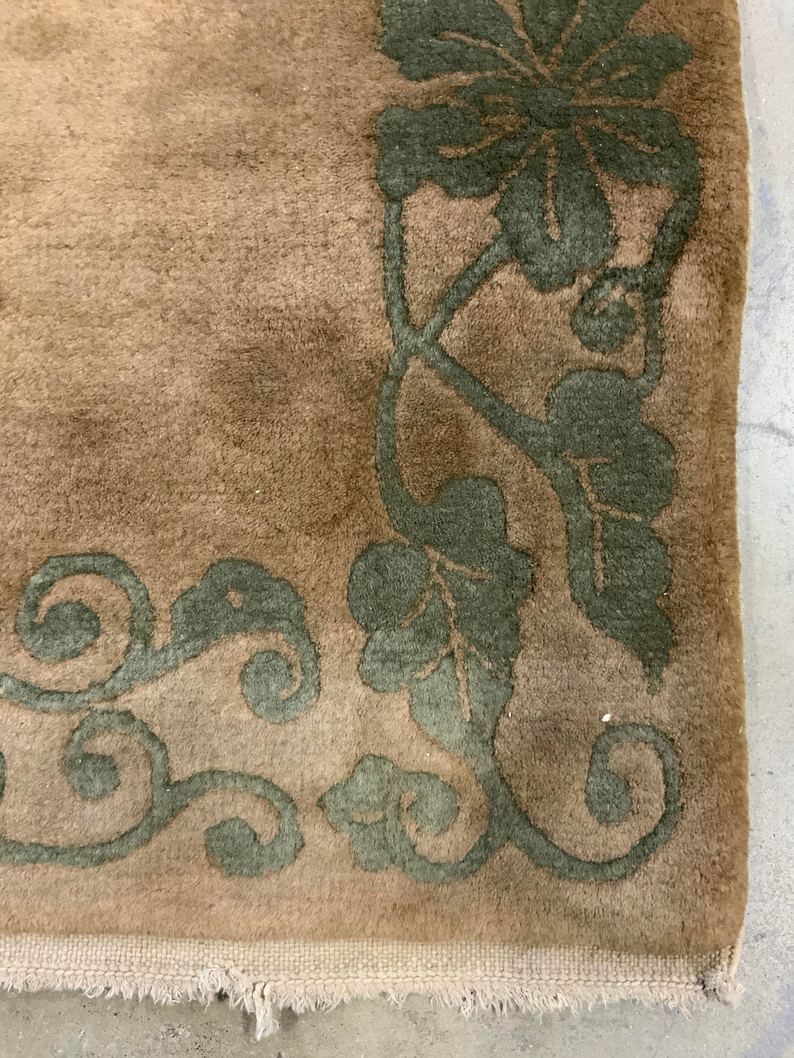 Vintage Chinese Art Deco Wool Rug: Rug is handmade and wool. Piece is vintage possibly antique. Rug has sand toned fringes at edges. Rug has intricate multi toned floral detail measures approx 62 inches long 36 inches wide. Rug, wool r