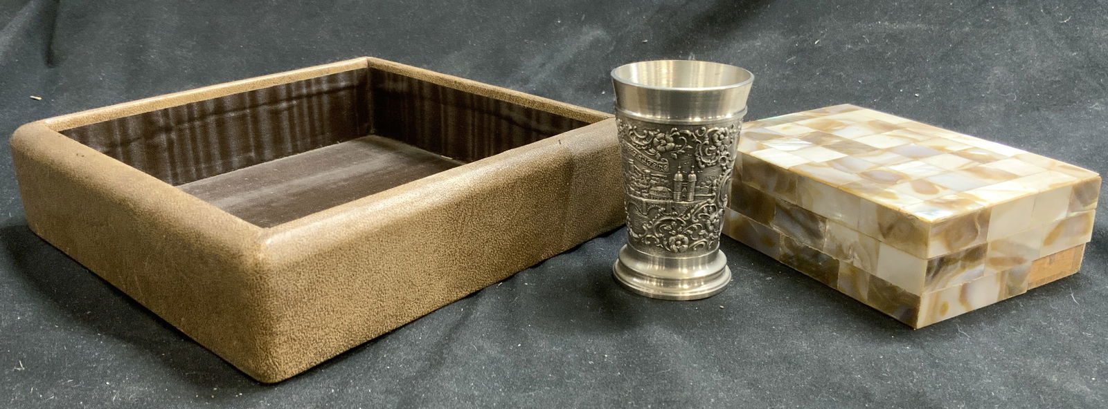 Lot 3 Tabletop Accessories, German Pewter, MOP +: Lot includes 1 letter holder which appears to possibly be lined in light brown toned leather, 1 mother of pearl trinket box, & 1 German pewter wine cup. Letter holder measures approximately 6.5 inches