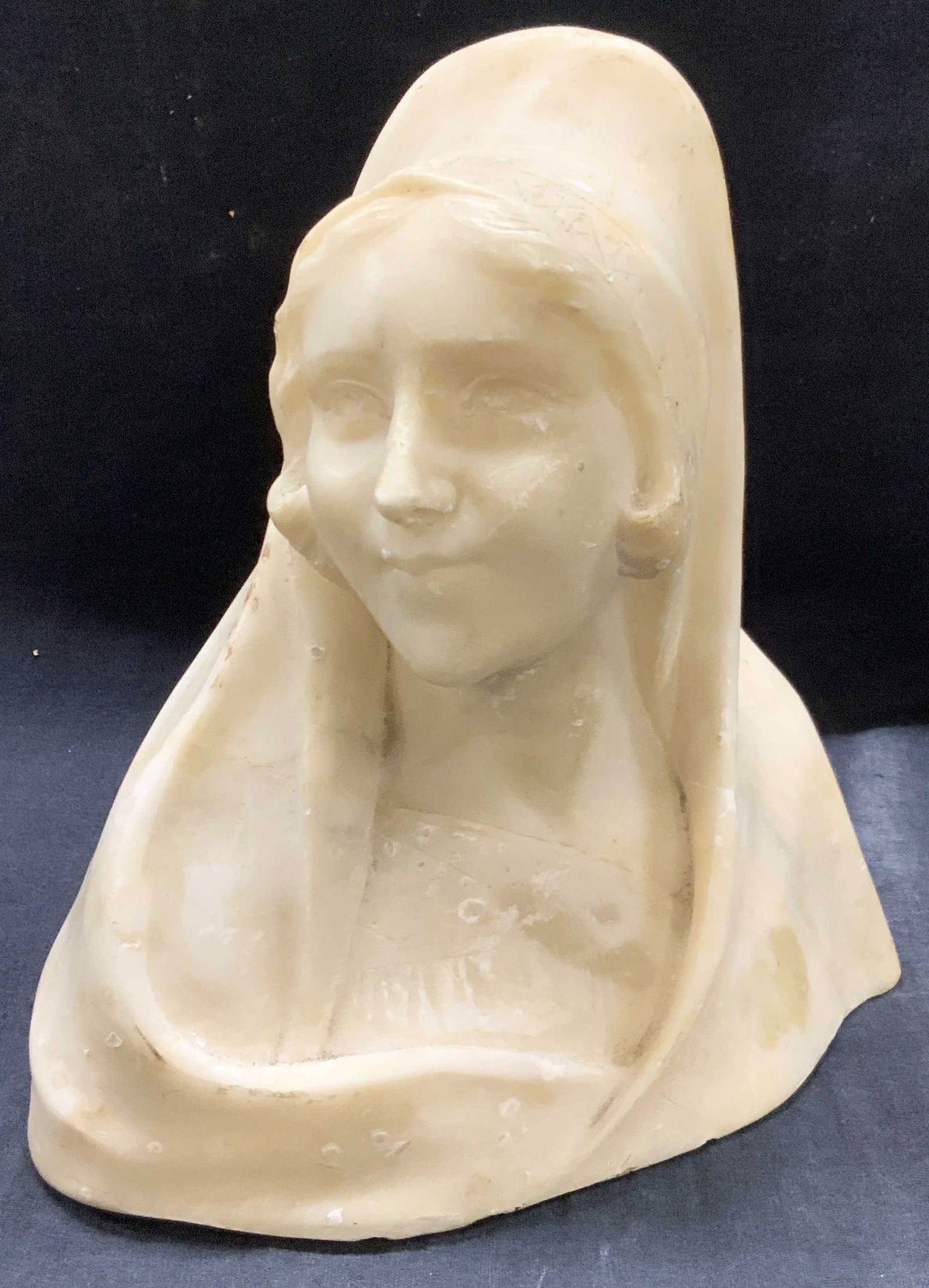 Vntg Carved Stone Woman Bust: Vintage carved stone bust of a woman in robes with a hood covering her head. Approx 9.25 inches tall, 8 inches, long and 4 inches wide. Evident wearing and loss to stone due to age and use. Stone deco