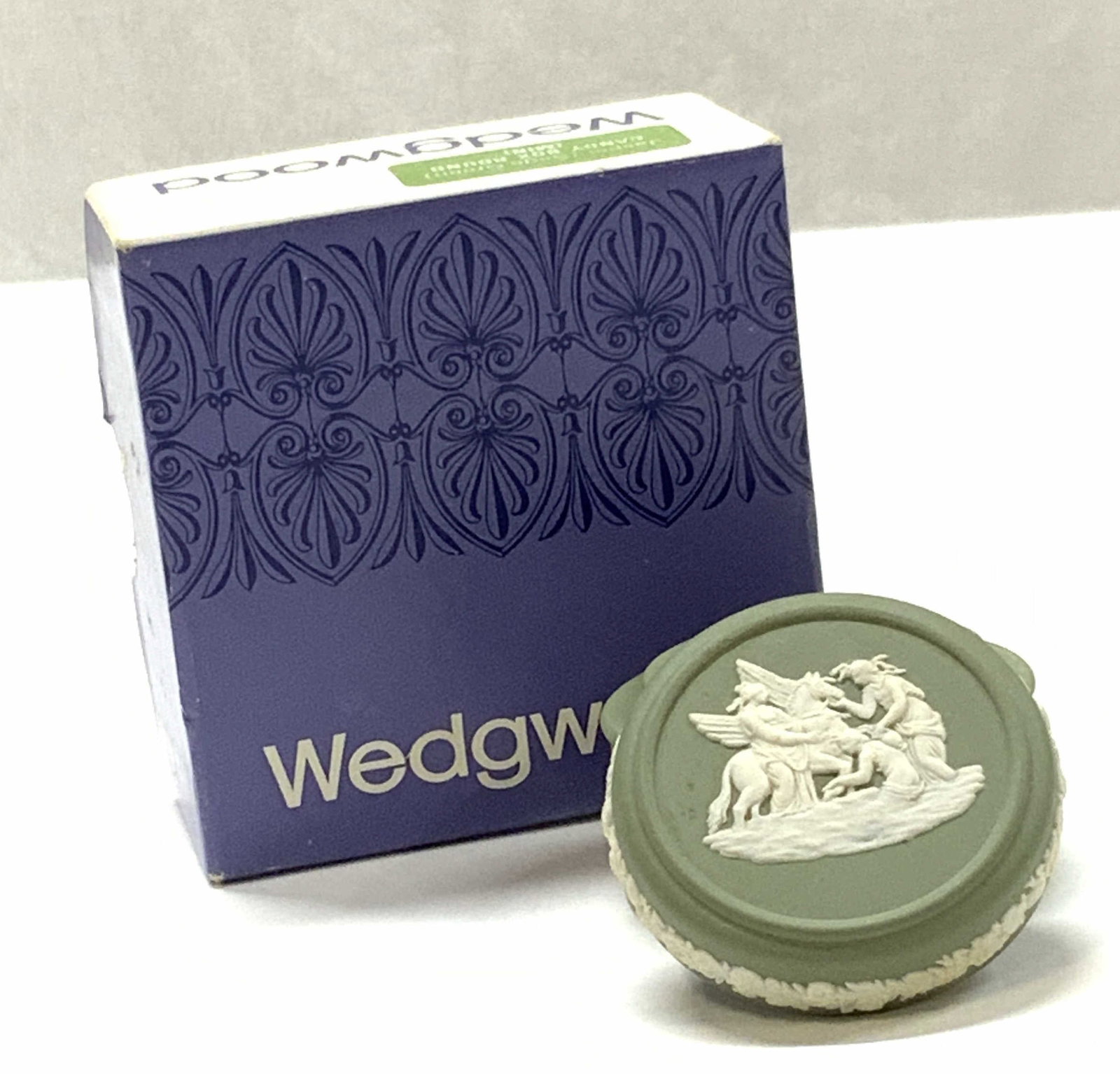 Wedgwood England Jasperware Candy / Trinket Box NIB: Wedgwood England Porcelain Jasper ware sage green trinket box. The underside reads Wedgwood Made in England and Impressed numbers and letters. 1.25 in tall. 1.75 in wide. Comes in the original box. Ap