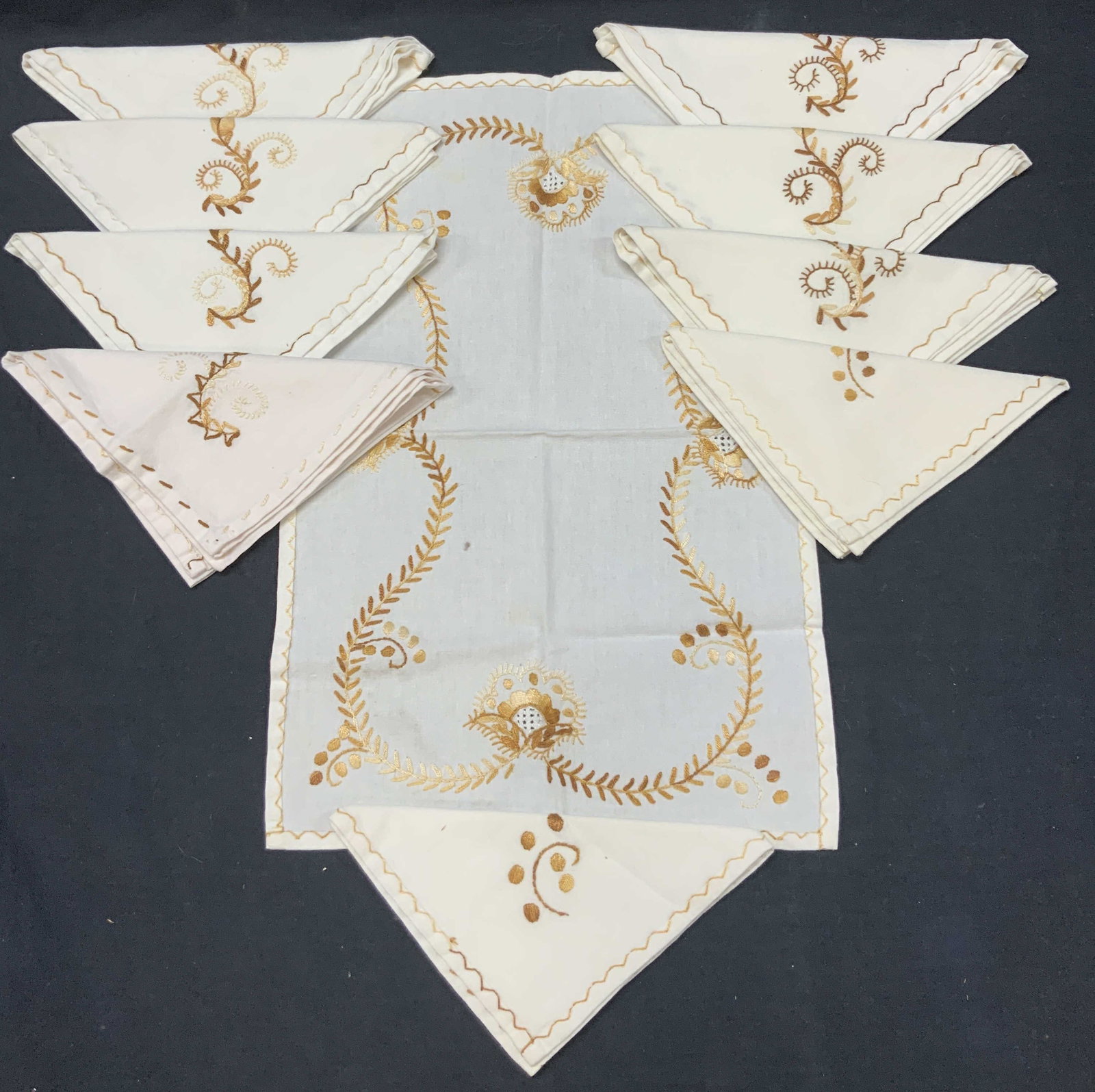 Set 10 Embroidered Cotton Kitchen Accessories: Set of 10 cotton kitchen cloths with embroidery in brown and golds with designs differing in colors. 3 napkins with dark scrolls floral designs. 4 with light tones scroll and floral designs, 2 napkins