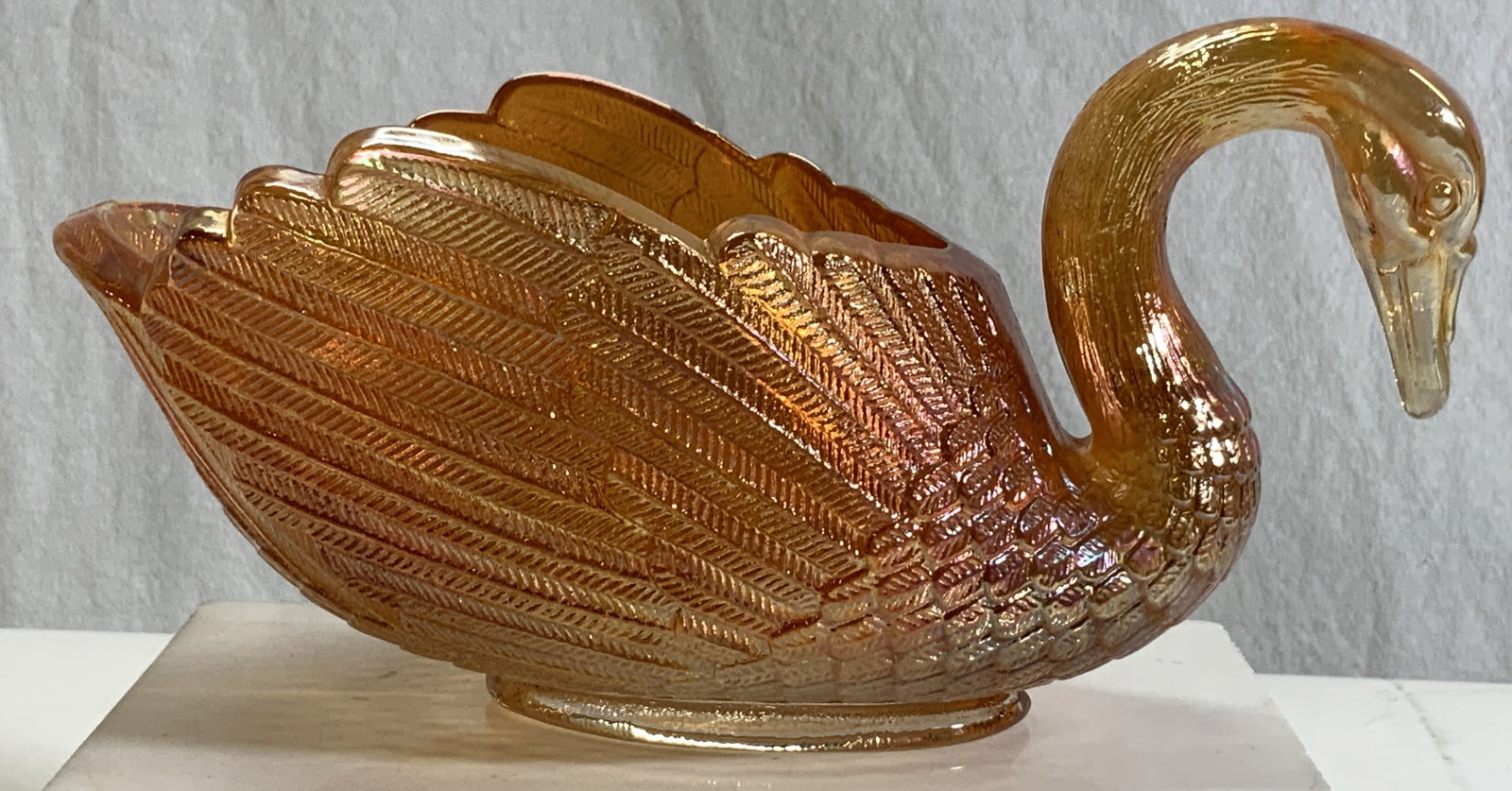 Vntg Imperial Carnival Glass Orange Swan Bowl, Sgn: Signed Vintage carnival glass orange swan bowl. Thick walls, short pedestal base, delineation of feathers to wings. Signed with trademark, appears to be Imperial G Hallmark . Measures approx. length 1