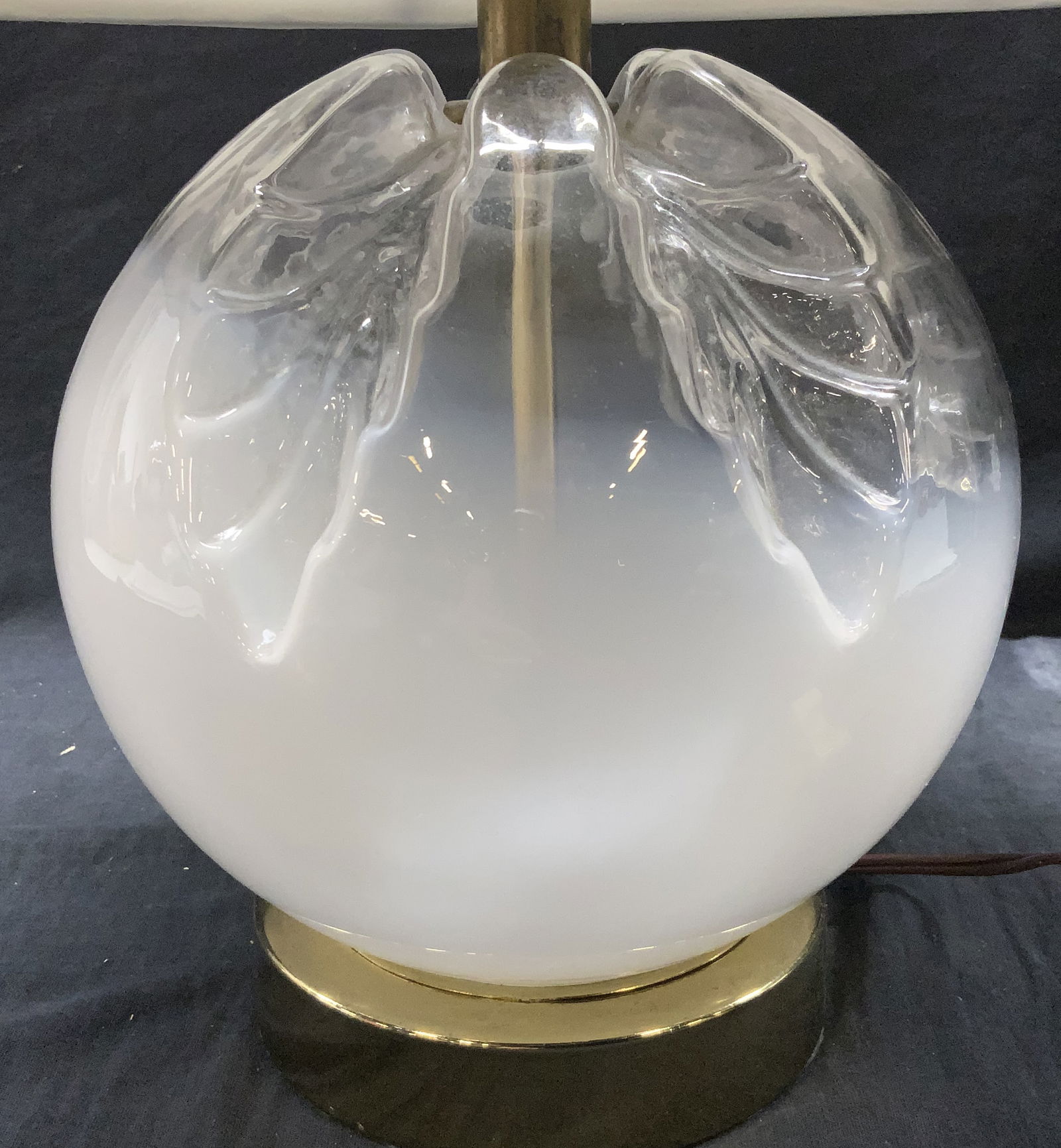 Ombr? Art Glass Lamp W/ Bell Shade: Lamp with opaque to clear gradient base and leaf pattern indentation. Bell shaped lamp shade, possibly silk. Brass base. Lamp has a finial. Light switch located on the cord. Not tested for functionali