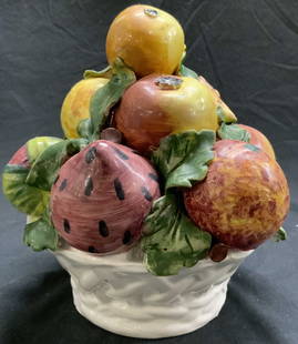 Vintage Hand Painted Porcelain Fruit Arrangement: Piece is vintage and porcelain. Fruit arrangement is hand painted depicting various multi toned fruits & leaves. Piece has white toned basket form vase. Piece measures approximately 8 inches tall 6.5
