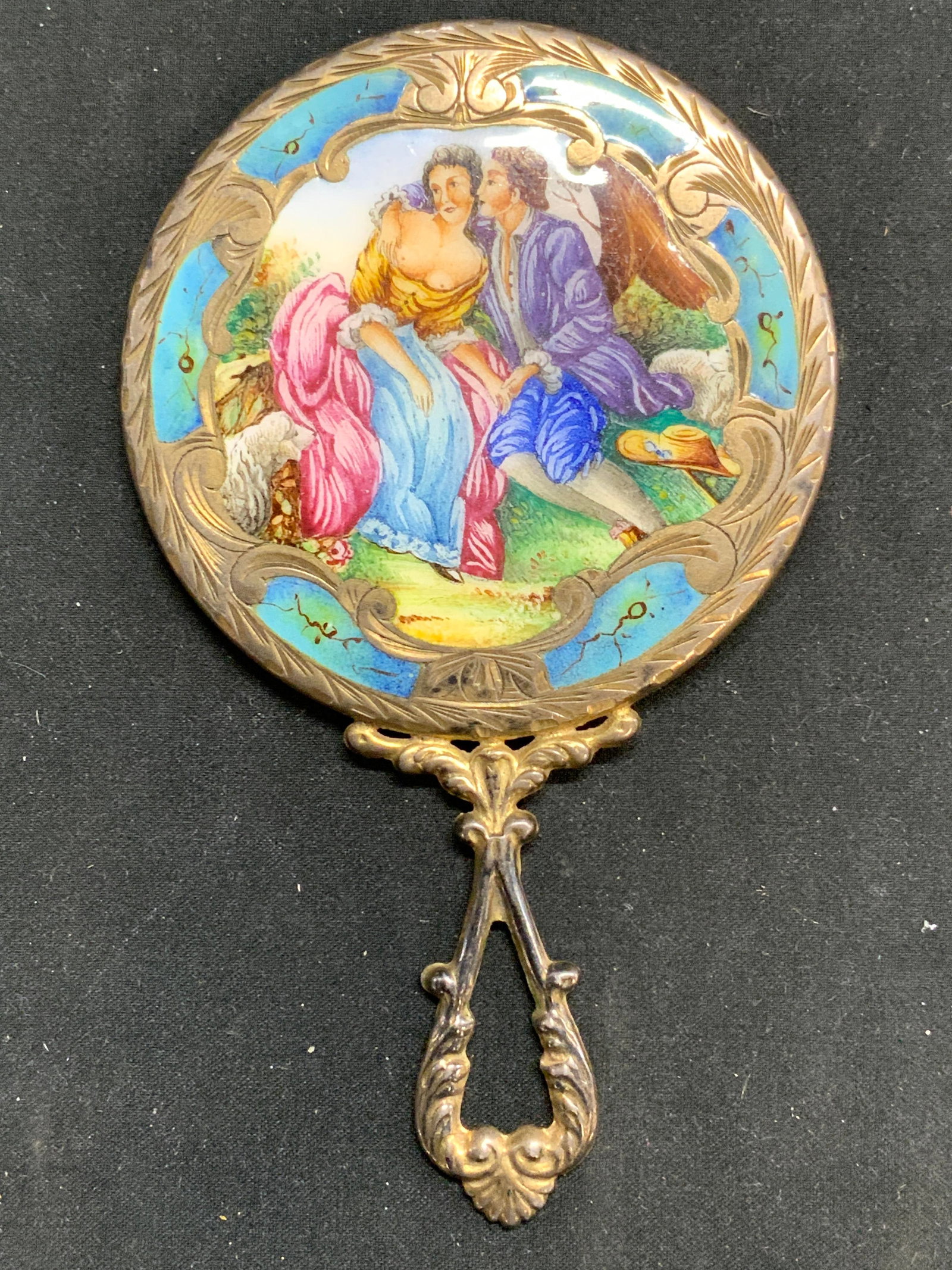 Silver Plate & Enamel Vntg Italian Purse Mirror: Hallmarked, 800 Italy. Purse mirror is vintage. Piece is silver plate and enamel. Mirror has relief and scroll detail. Piece also has depiction of male and partially nude female figure. Mirrored surfa