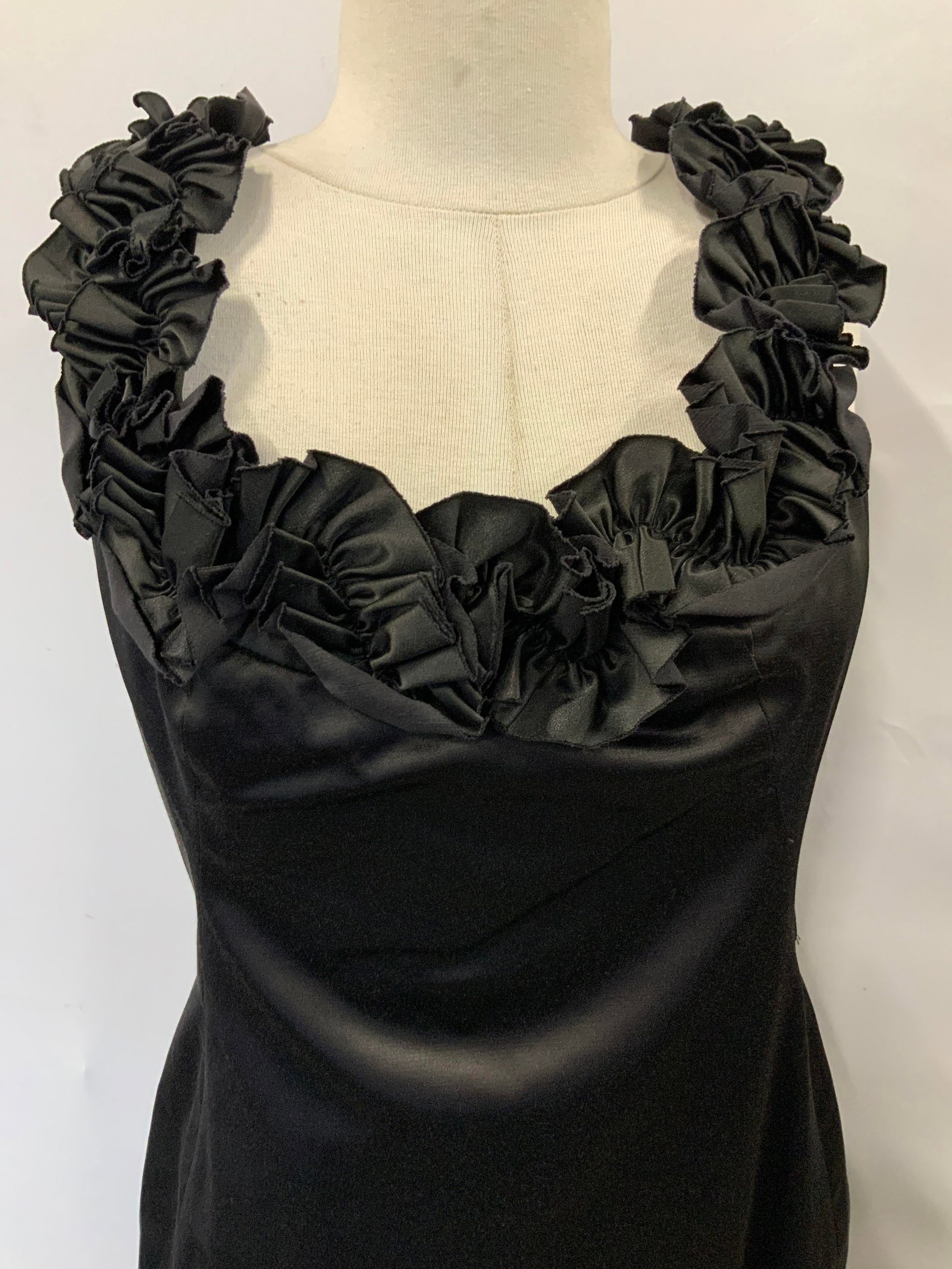 Maggy London Black Cocktail Dress: Maggy London Size 8 cocktail dress with rose eats along the collar and sleeves. 62% cotton, 35% polyester, 3% spandex. Sleek , curvaceous fit. Little black dress, black cocktail dress, special occasio