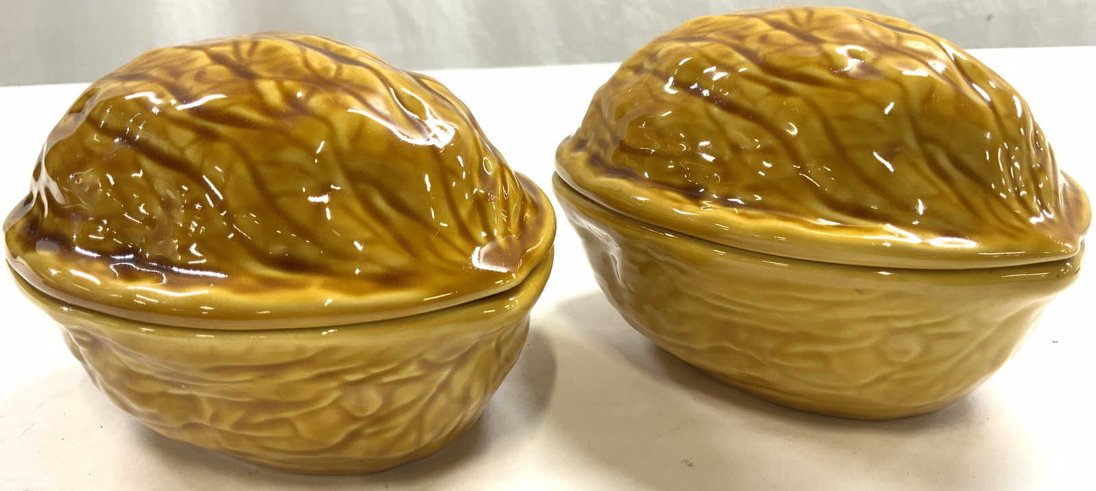 Pr Walnut Form Porc Lidded Trinket Boxes FRANCE: Undersides are marked MADE IN FRANCE. Lot includes 2 trinket boxes. Trinket boxes are each tan toned with walnut form. Each box includes lid. Both measure approximately 5.5 inches deep 4.25 inches wid