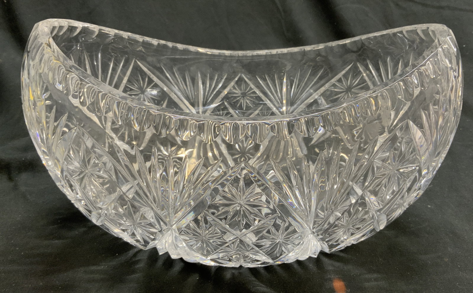 Cut Crystal Kidney Boat Bowl Vessel: Bowl is cut crystal. Piece has kidney bean boat form. Bowl has intricately cut geometric detail. Bowl measures approximately 10.5 inches long 6.25 inches deep 5.5 inches tall. Bowl, vessel, kidney bow