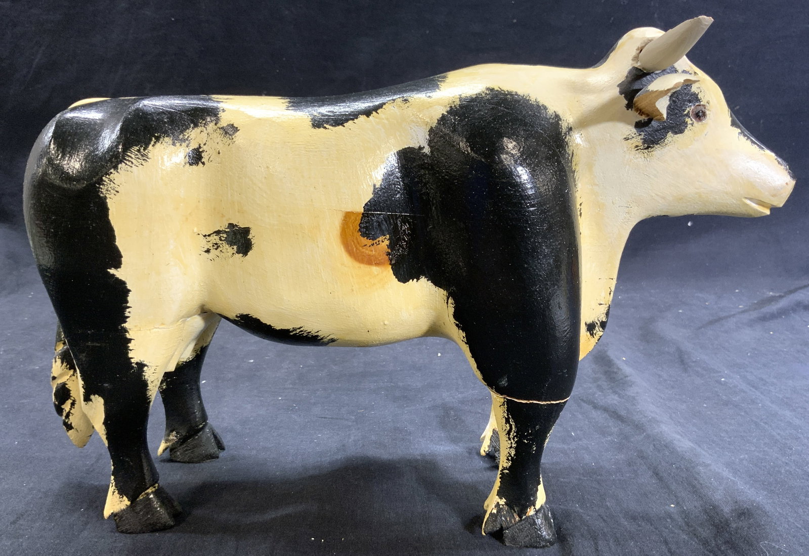 S ALLARD Signed Carved Wooden Cow Figure 88: Underside is signed S ALLARD dated 88. Cow figure is wooden, possibly hand crafted. Piece is cream and black toned. Cow figure has horns & utters. Piece measures approximately 12.5 inches deep 8 inche