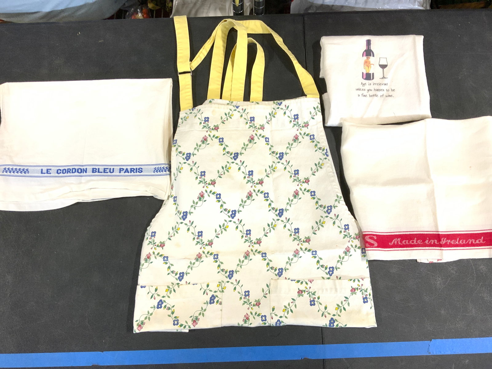 4 Linen & Cotton Vntg Hand Towels, Floral Apron: Heavy cotton floral apron with 2 pockets, adjustable neck strap, measures 34 in. Long x 24 in. Wide, straps measure 34 in. Long each. Hilden Cotton hand towel with cute wine motif, reads Age is Irrele