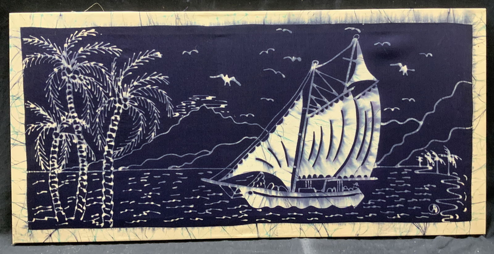 Palm Trees & Sailboat Stretched Fabric Print: Inscription in bottom right corner. Inscription illegible. Signature in print. Subject depicts palm tree and a sailboat in a bay. Stretched on internal frame. Internal frame measures 33 W x 16 H in. N